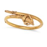 AN ANTIQUE ETRUSCAN REVIVAL GOLD RAM BANGLE in yellow gold, the hinged bangle terminating with a ...