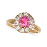 AN ANTIQUE PINK SAPPHIRE AND DIAMOND CLUSTER RING in yellow gold, set with an octagonal step cut ...