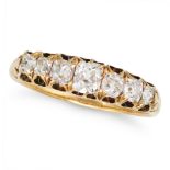 A FINE ANTIQUE SEVEN STONE DIAMOND RING in 18ct yellow gold, set with a row of seven graduating o...