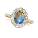A BLACK OPAL AND DIAMOND CLUSTER RING in 18ct yellow gold, set with an oval cabochon black opal i...