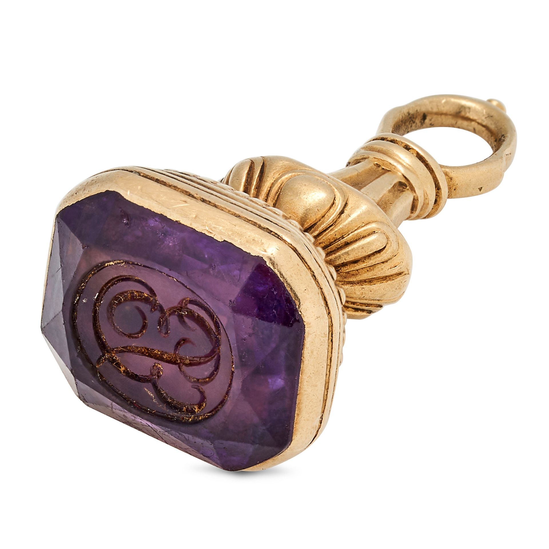 NO RESERVE - AN ANTIQUE AMETHYST INTAGLIO FOB SEAL PENDANT the fluted seal set with an amethyst i...