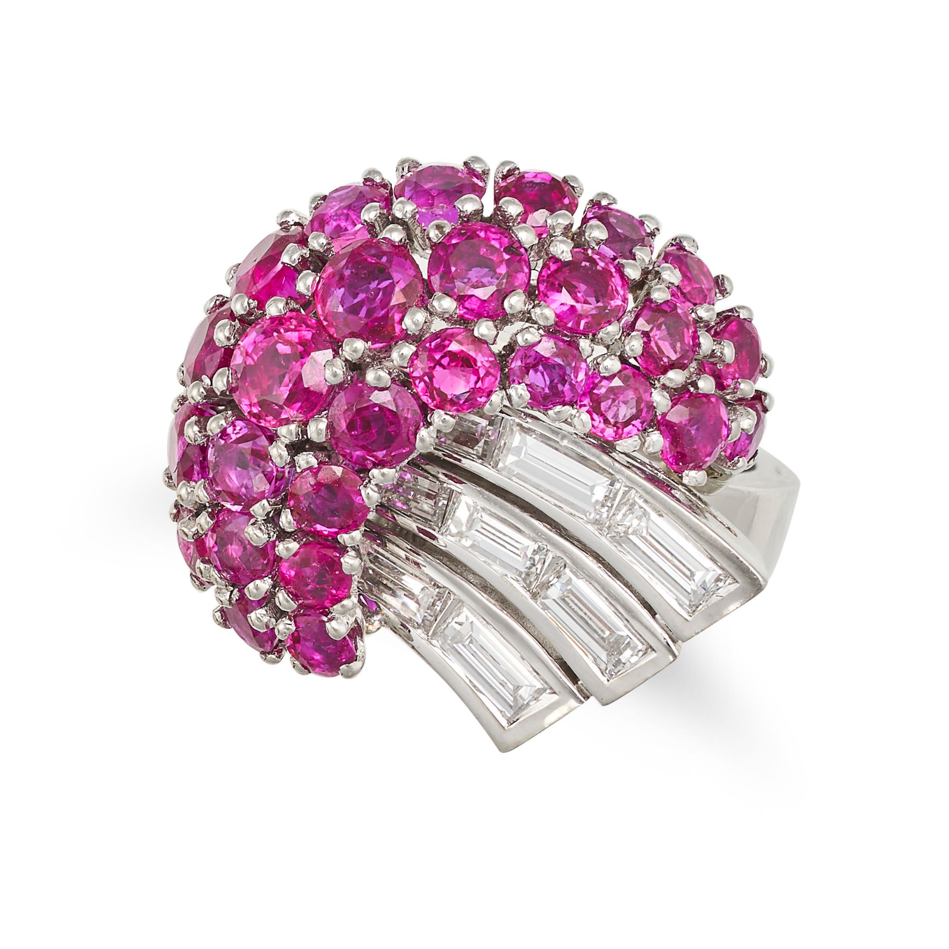 A RUBY AND DIAMOND RING in platinum, set with three rows of round cut rubies accented by a spray ...