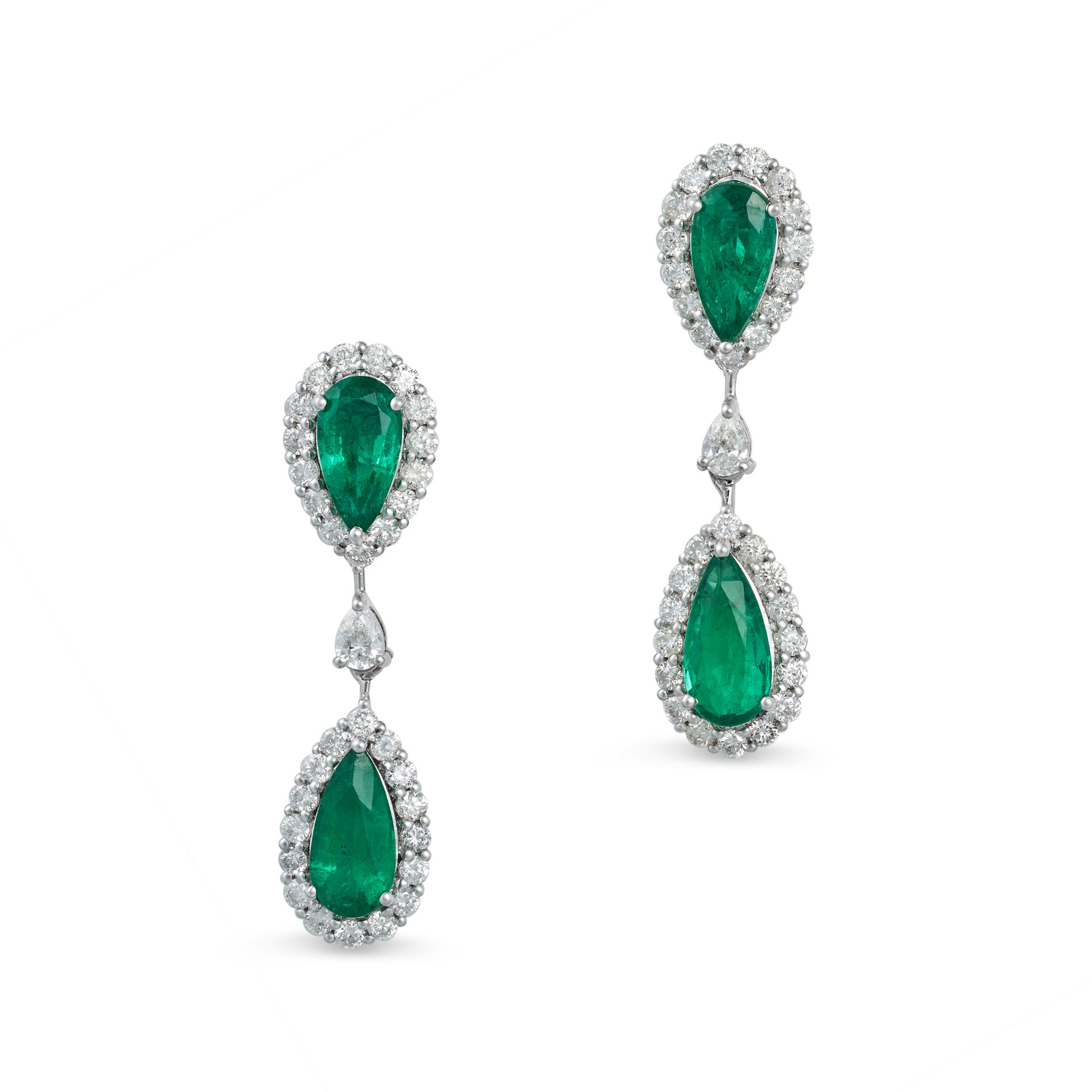 A PAIR OF EMERALD AND DIAMOND DROP EARRINGS in 18ct white gold, each set with two pear cut emeral...