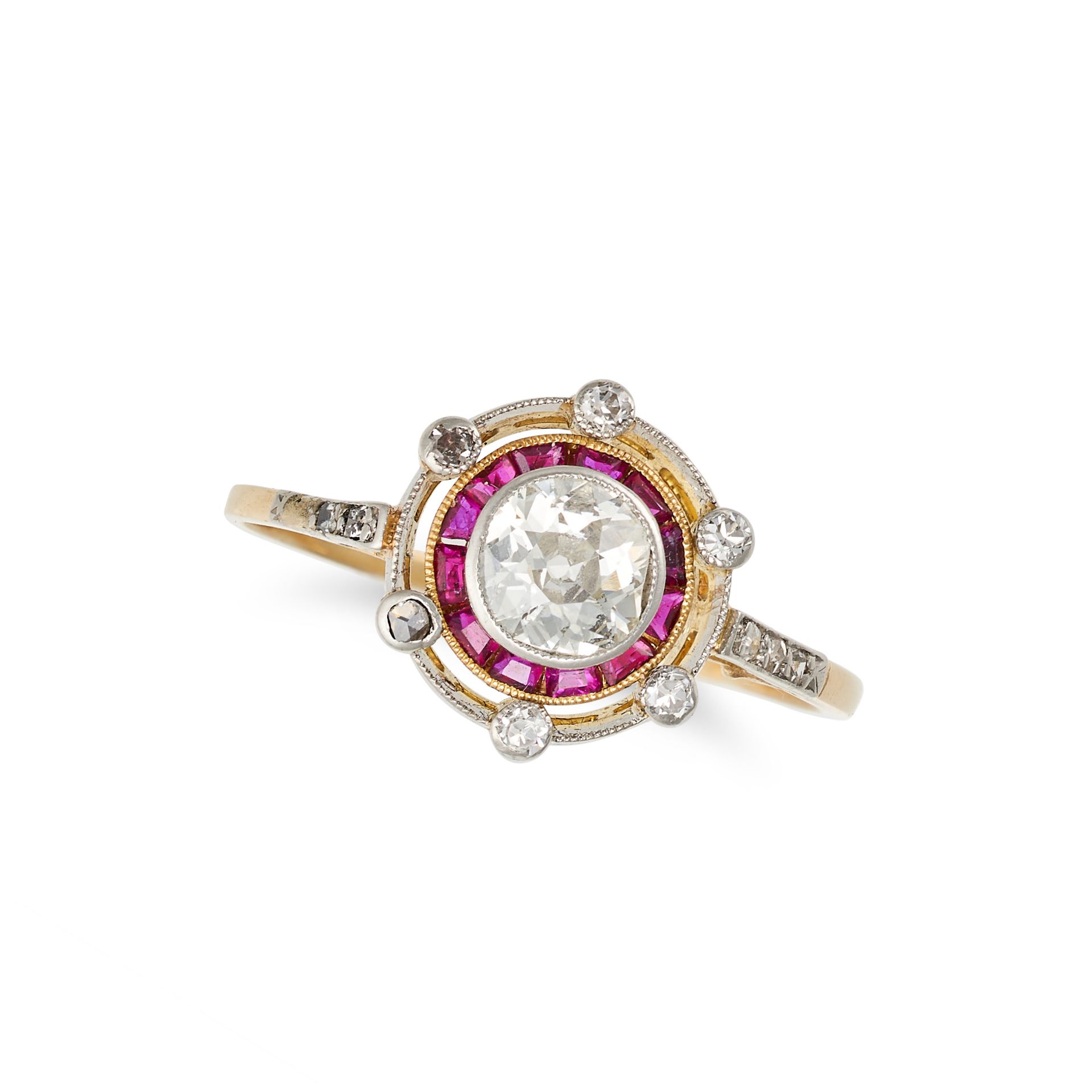 A VINTAGE DIAMOND AND RUBY TARGET RING in 18ct yellow gold and platinum, set with an old European...