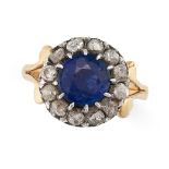 NO RESERVE - AN ANTIQUE SAPPHIRE DOUBLET AND DIAMOND CLUSTER RING in yellow gold, set with a roun...