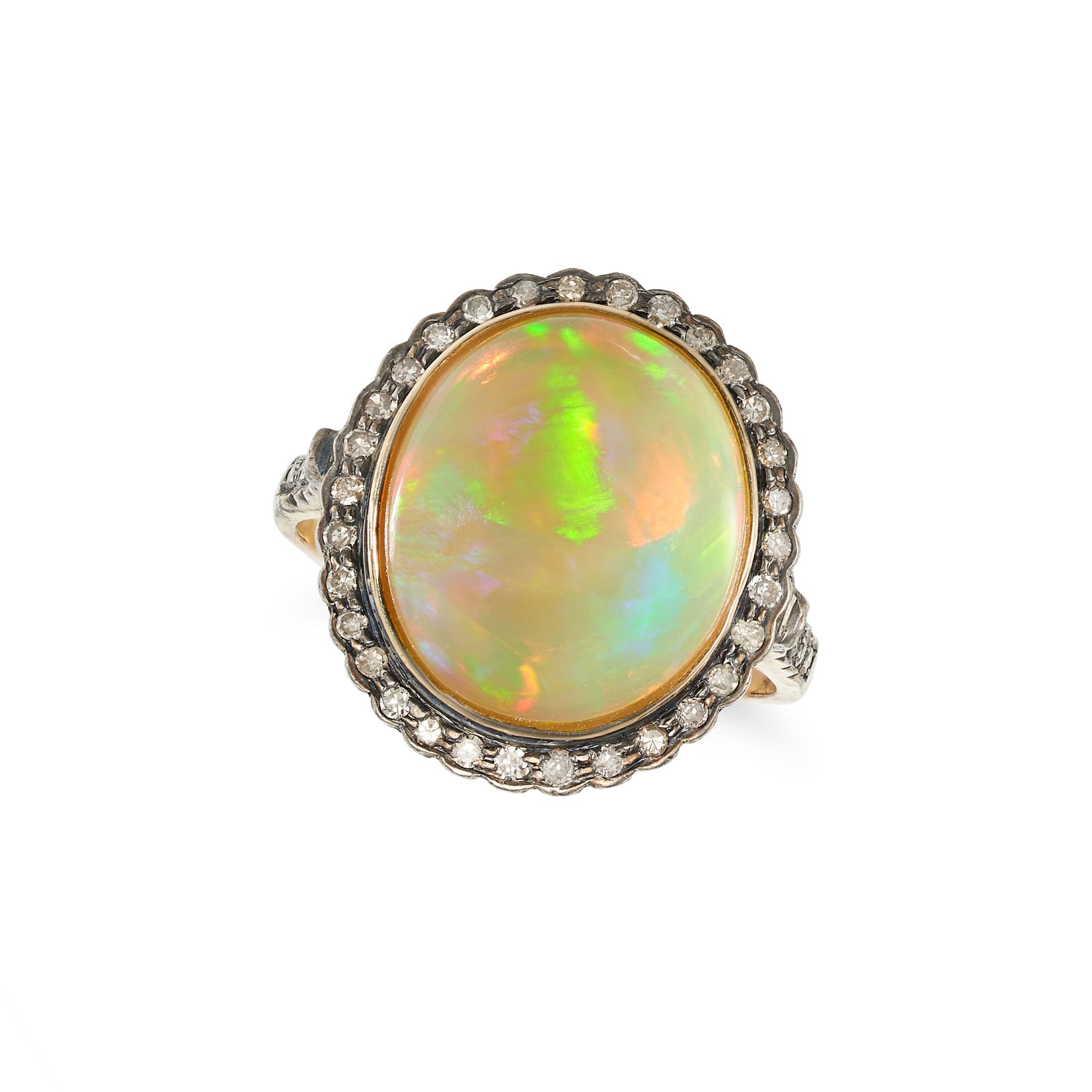 AN OPAL AND DIAMOND CLUSTER RING in yellow gold and silver, set with an oval cabochon opal in a b...