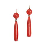 A PAIR OF CORAL DROP EARRINGS in yellow gold, each set with a round polished coral suspending a c...