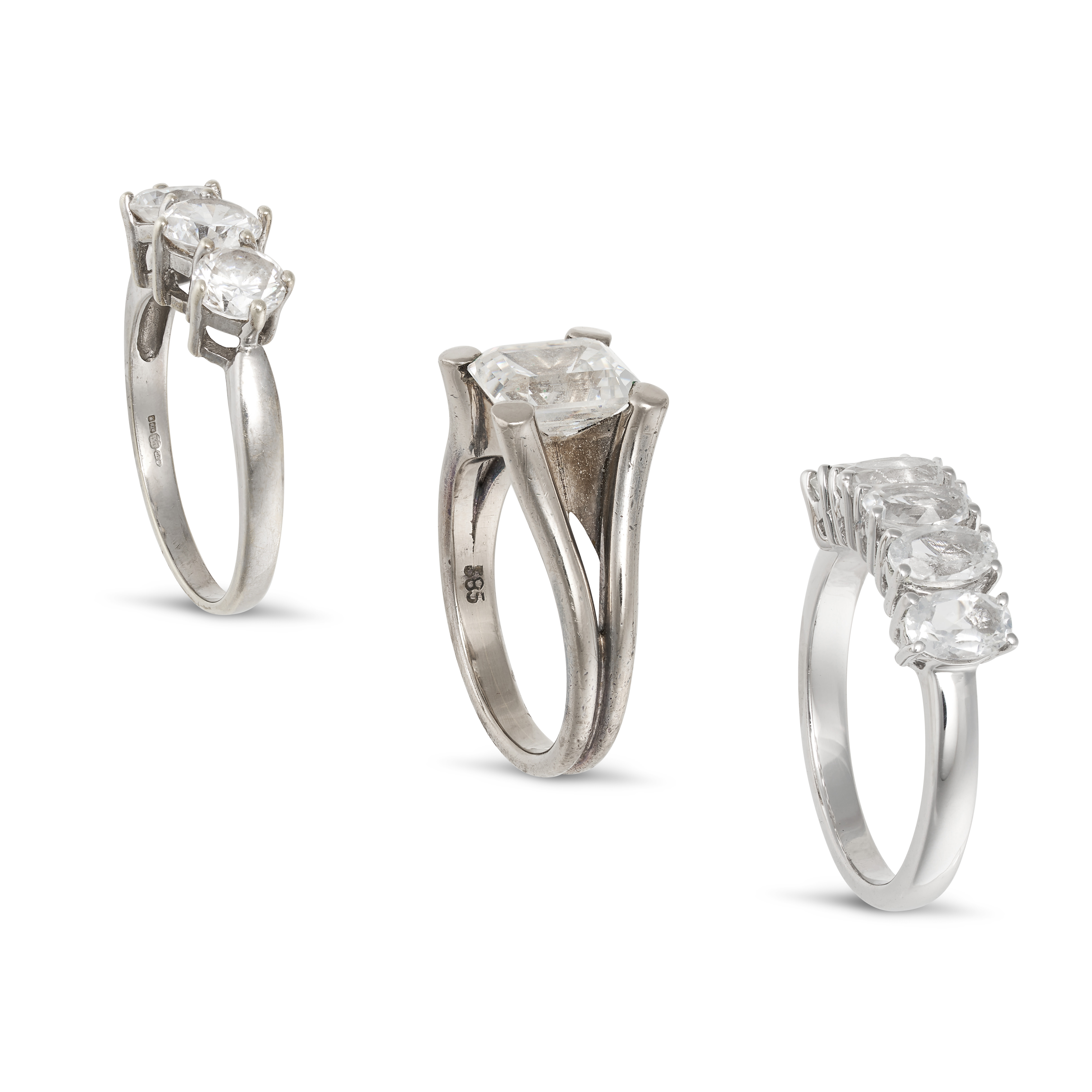 THREE WHITE GEMSTONE RINGS in white gold and silver, comprising a three stone ring set with three... - Image 2 of 2