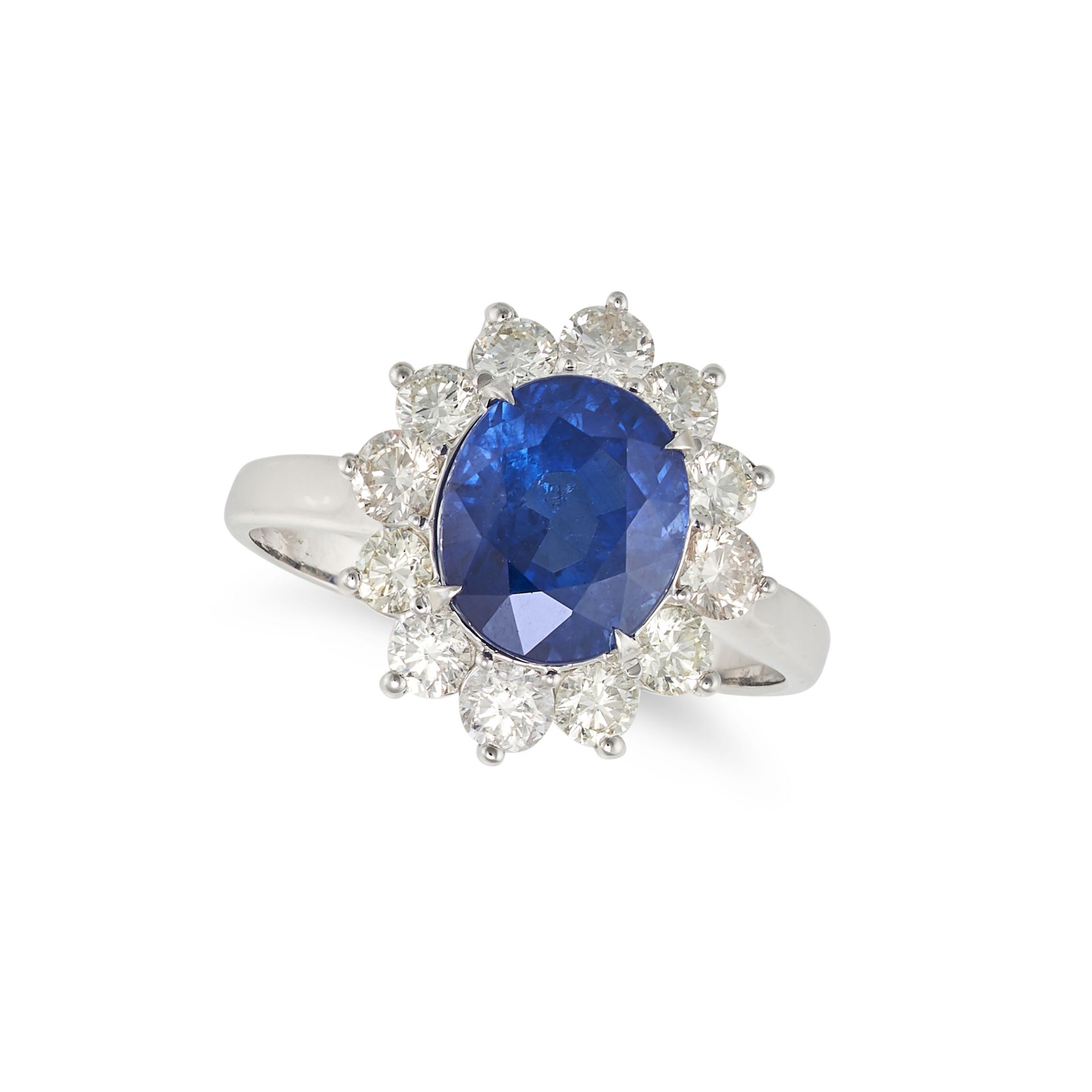 A SAPPHIRE AND DIAMOND CLUSTER RING in 18ct white gold, set with an oval cut sapphire of 3.02 car...
