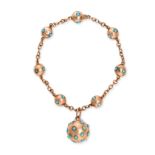 AN ANTIQUE TURQUOISE BRACELET in rose gold, comprising a chain accented by gold orbs set with cab...
