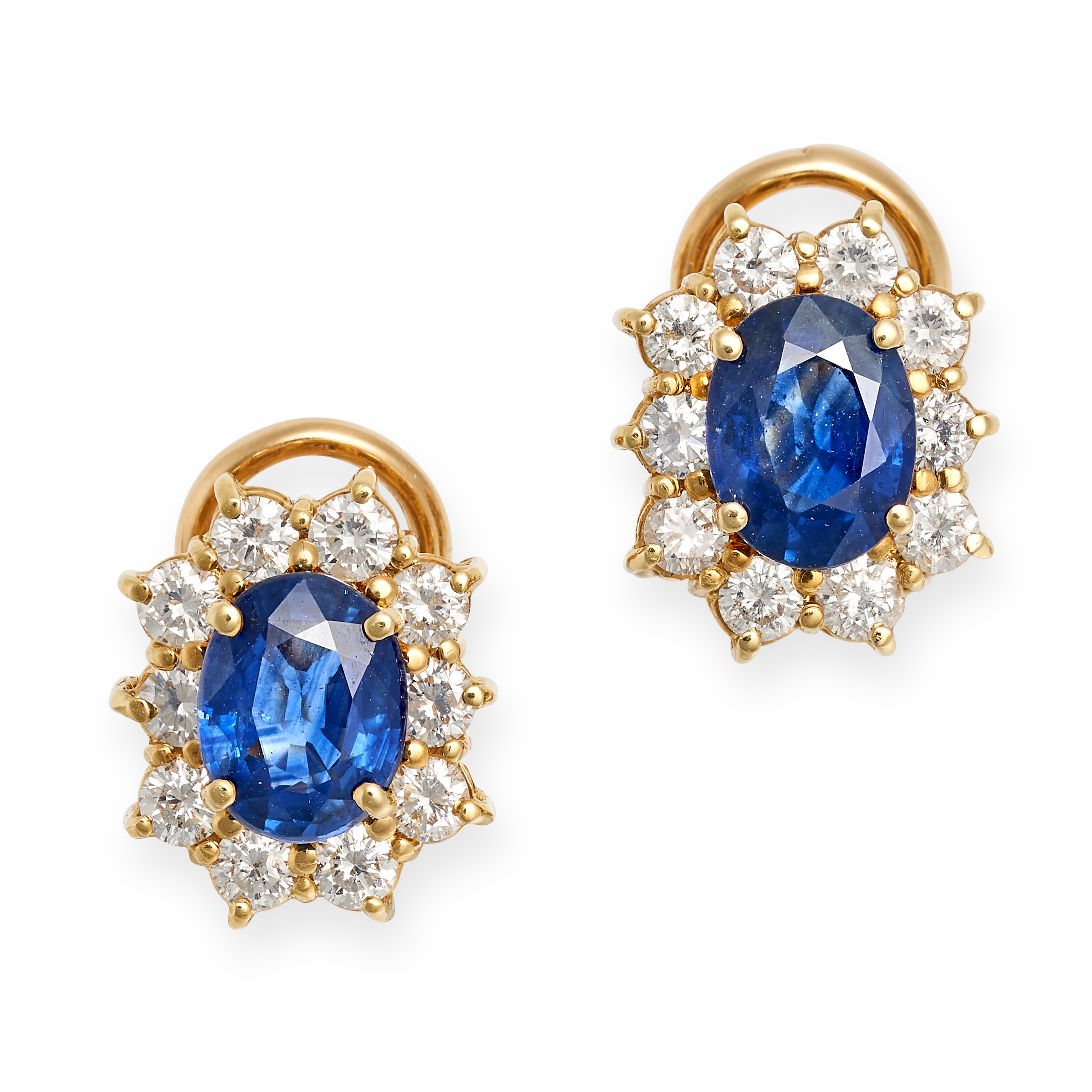 A PAIR OF SAPPHIRE AND DIAMOND CLUSTER EARRINGS in 18ct yellow gold, each set with an oval cut sa...