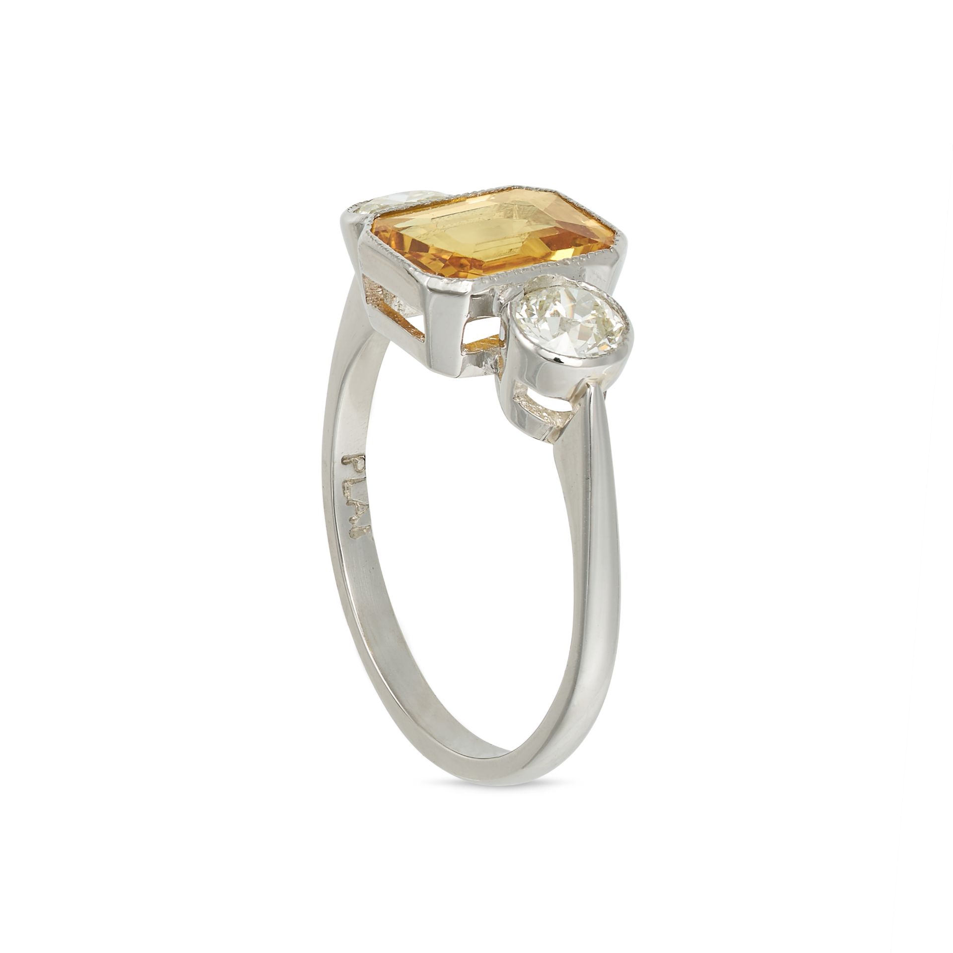 A YELLOW SAPPHIRE AND DIAMOND THREE STONE RING in platinum, set with an octagonal step cut yellow... - Bild 2 aus 2