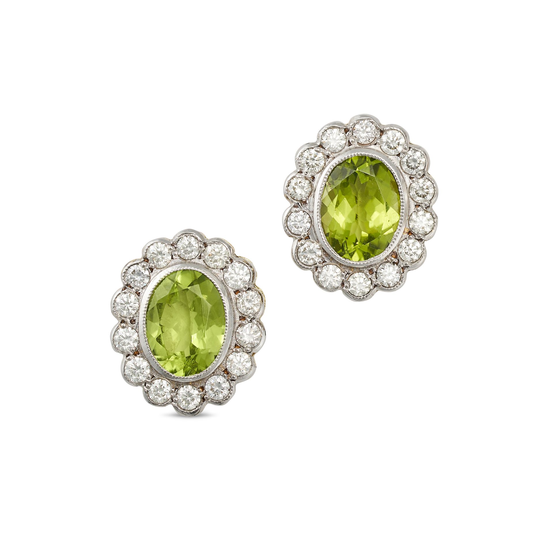 A PAIR OF PERIDOT AND DIAMOND CLUSTER EARRINGS in 18ct yellow gold, each set with an oval cut per...