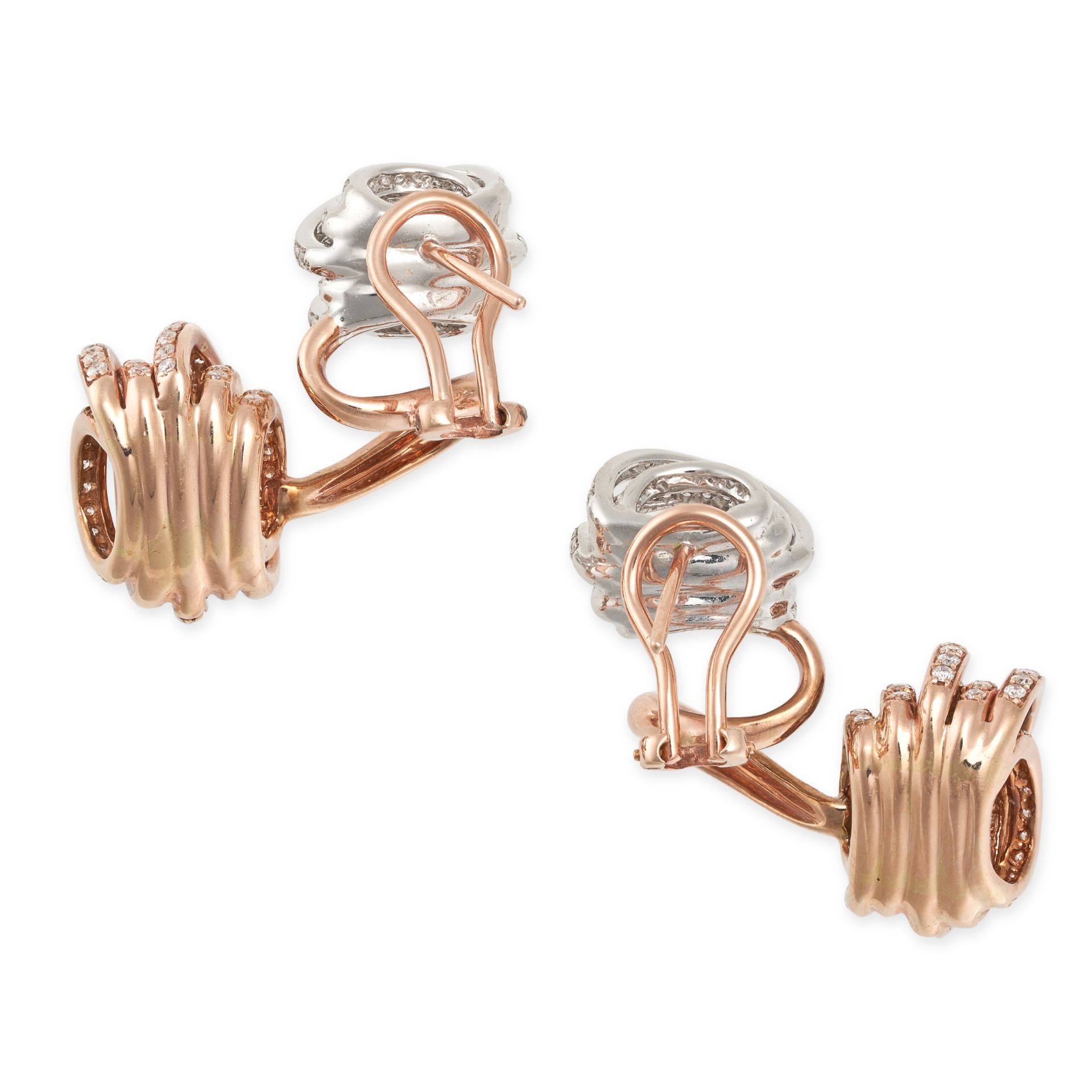 A PAIR OF DIAMOND EARRINGS in 18ct white and rose gold, comprising two sections set with seven ba...