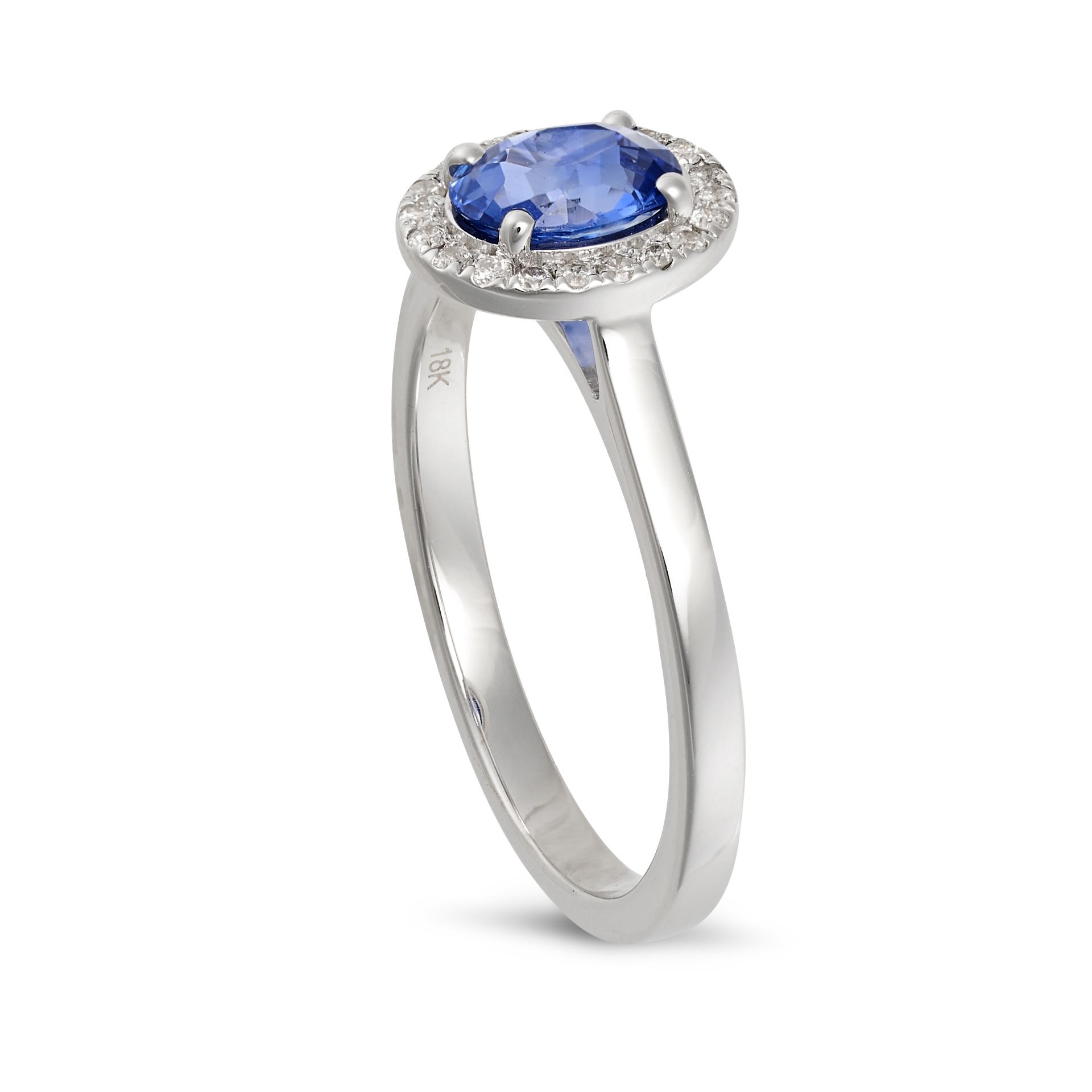 A SAPPHIRE AND DIAMOND CLUSTER RING in 18ct white gold, set with an oval cut sapphire in a cluste... - Bild 2 aus 2