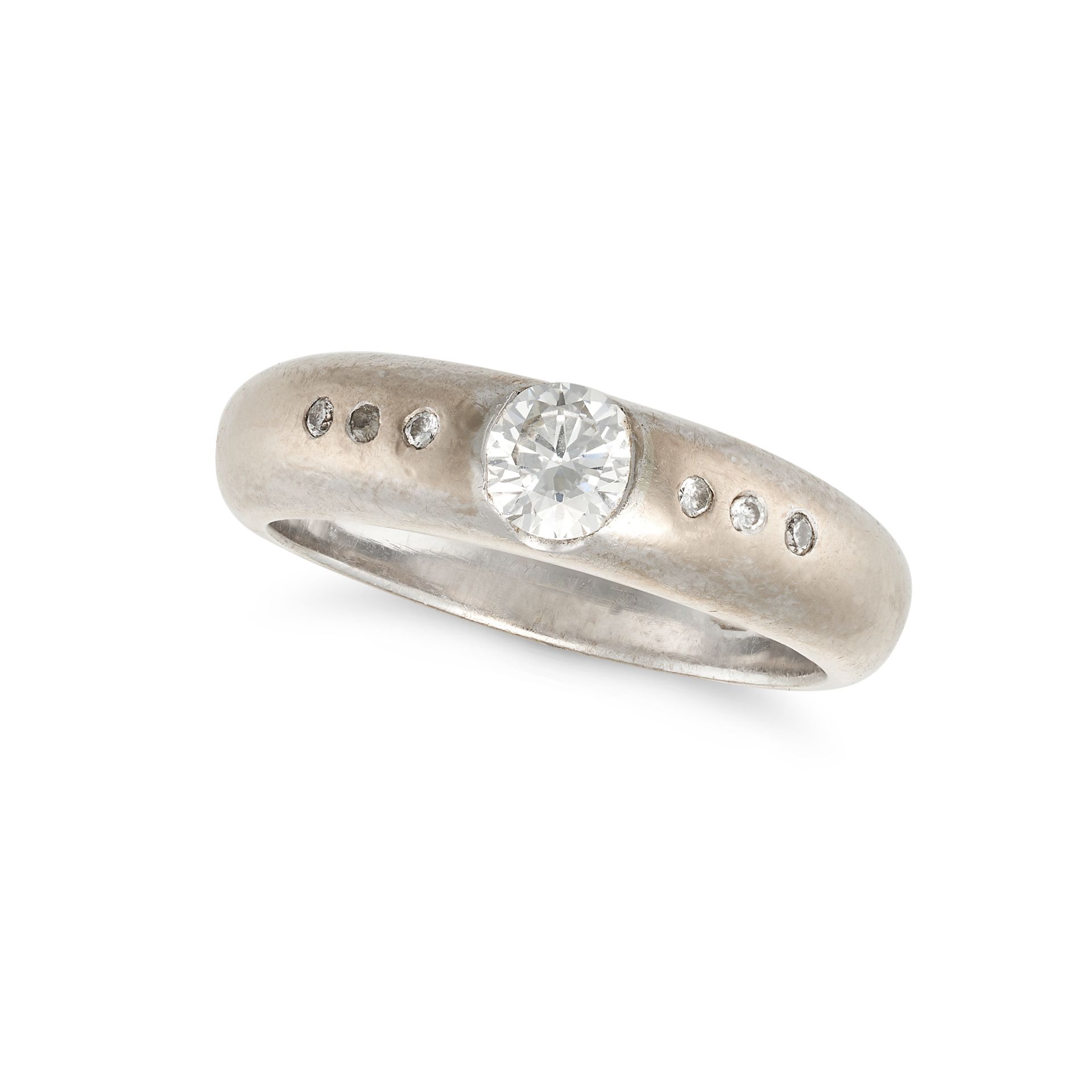 NO RESERVE - A DIAMOND BAND RING in 18ct white gold, set to the centre with a round brilliant cut...