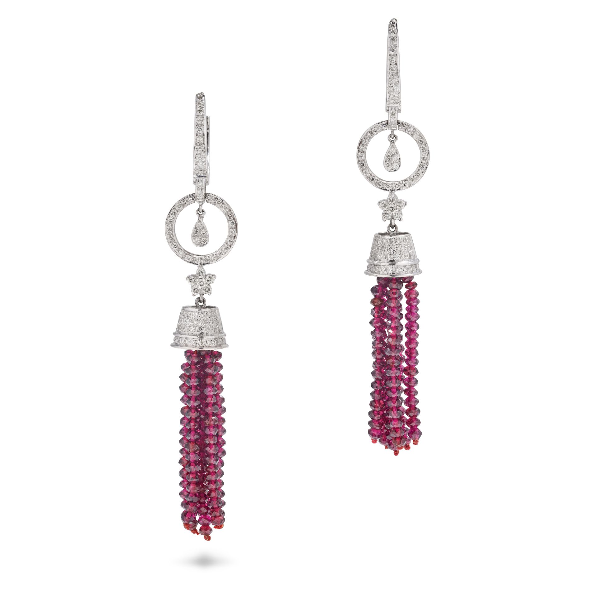 A PAIR OF RUBY AND DIAMOND TASSEL EARRINGS in 18ct white gold, each comprising a hoop set with a ...