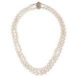 A TWO ROW PEARL AND DIAMOND NECKLACE comprising two rows of cultured pearls ranging from 5.6mm-10...