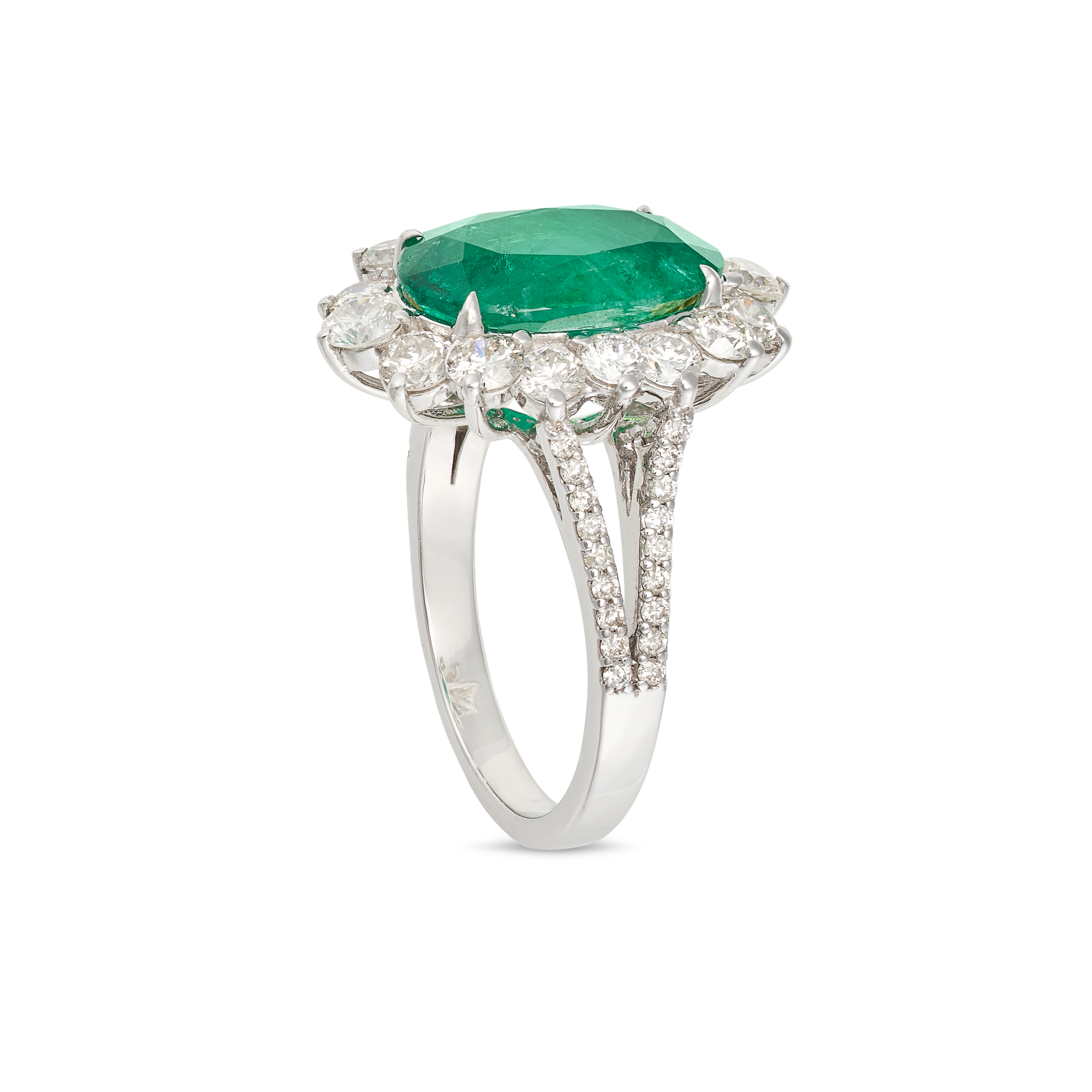 AN EMERALD AND DIAMOND CLUSTER RING in 18ct white gold, set with an oval cut emerald of 3.56 cara... - Image 2 of 2
