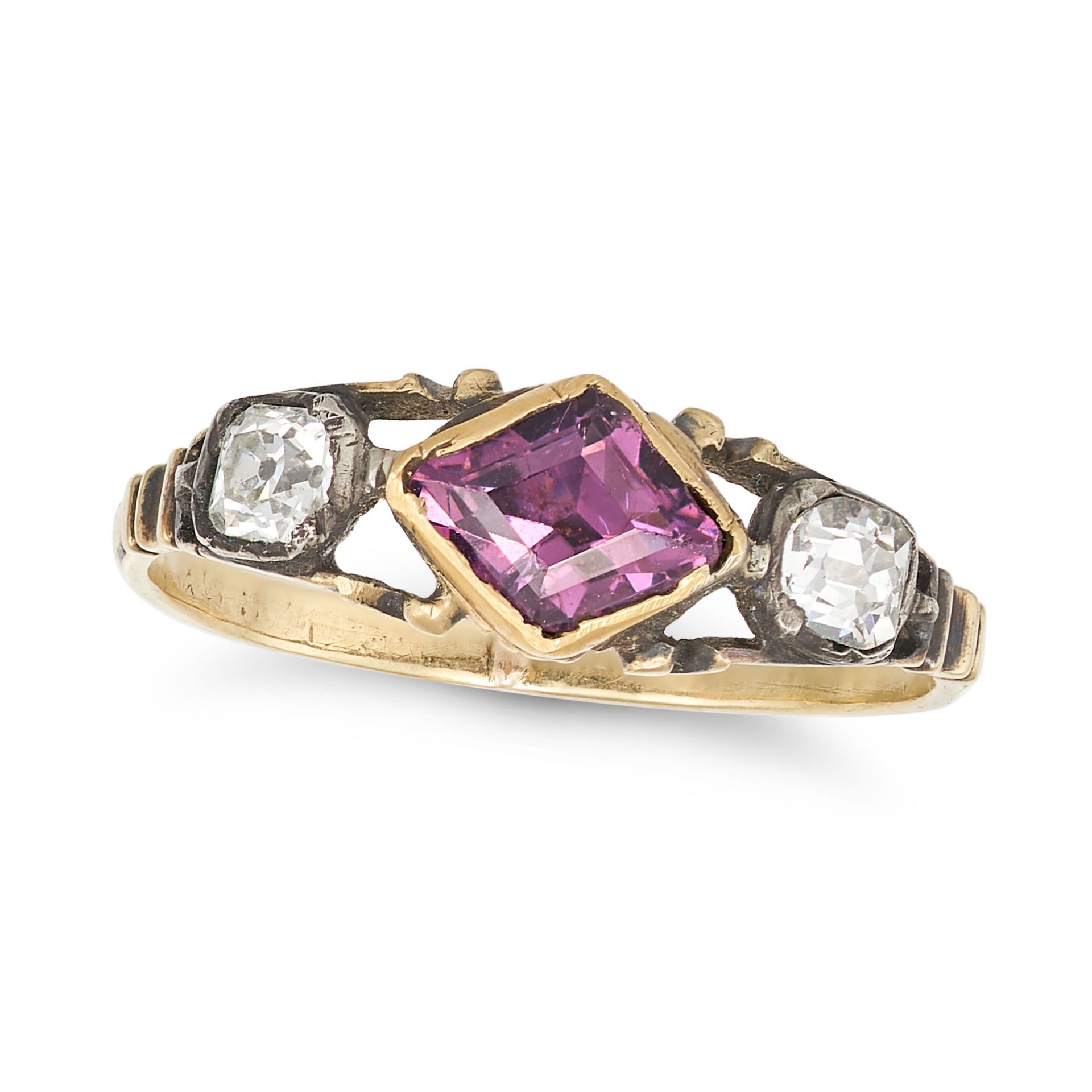 AN ANTIQUE AMETHYST AND DIAMOND THREE STONE RING in yellow gold and silver, set with a step cut a...