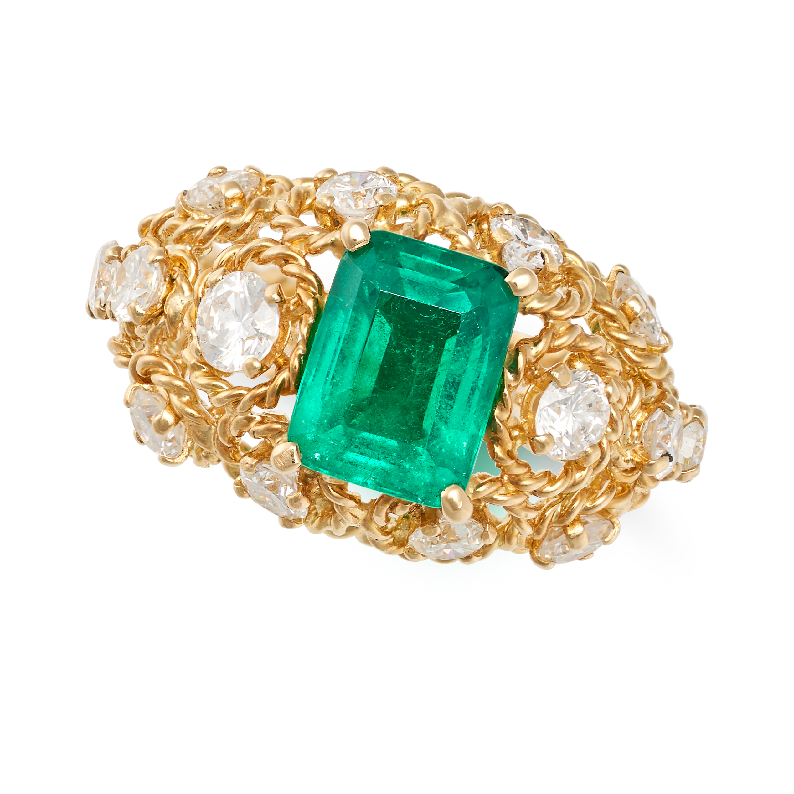 CHAUMET, A FINE COLOMBIAN EMERALD AND DIAMOND RING in 18ct yellow gold, the openwork domed body s...