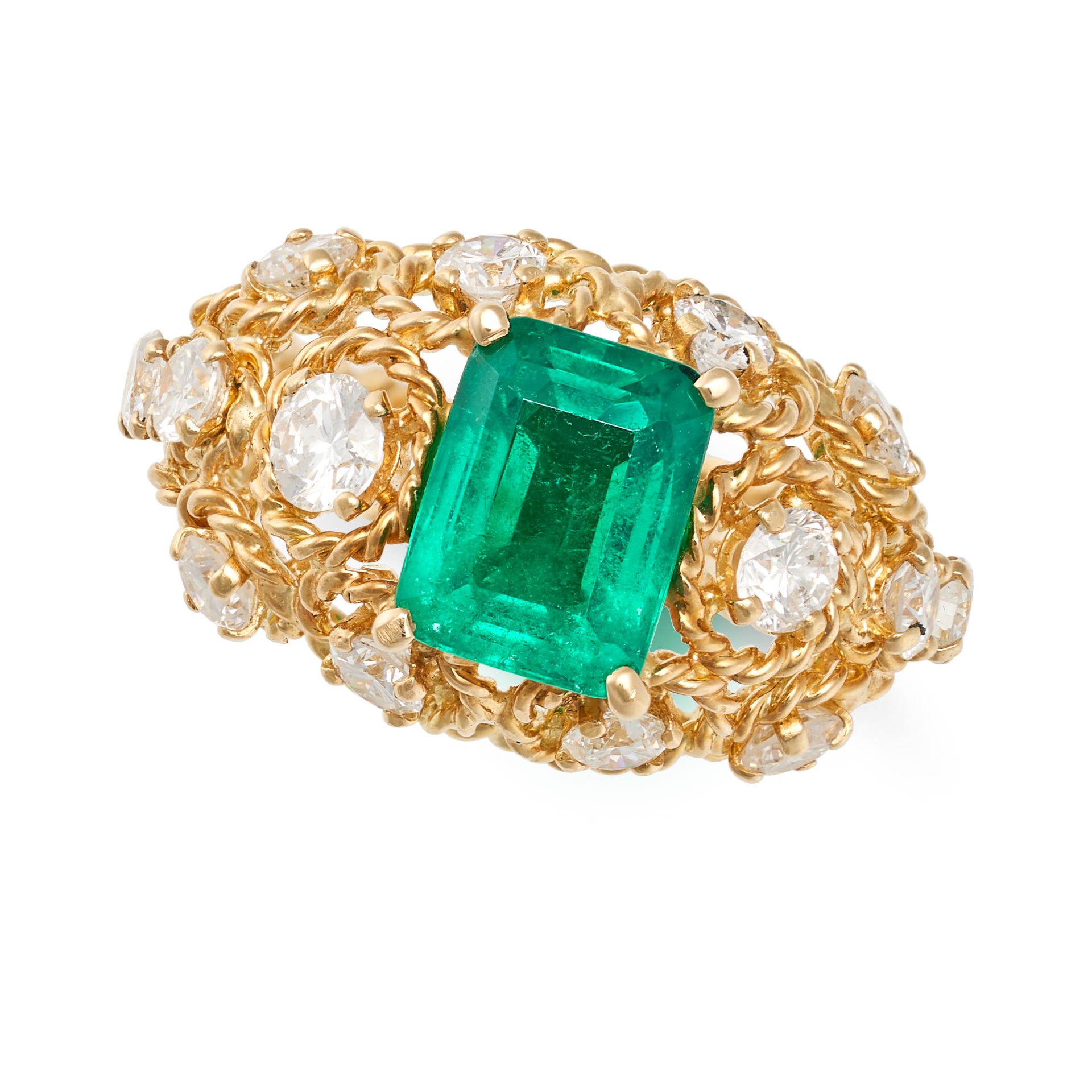 CHAUMET, A FINE COLOMBIAN EMERALD AND DIAMOND RING in 18ct yellow gold, the openwork domed body s...