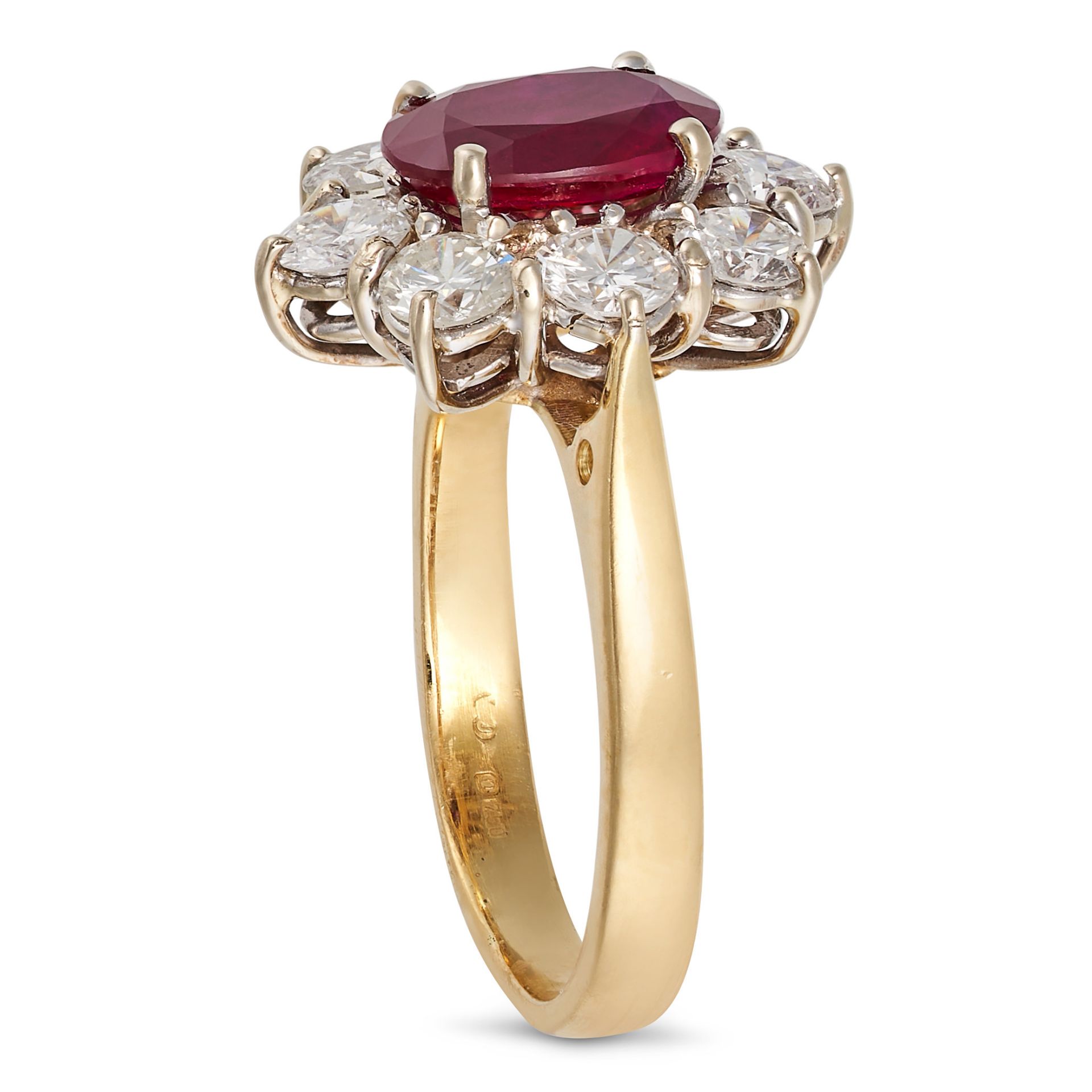 A RUBY AND DIAMOND CLUSTER RING in 18ct yellow gold, set with an oval cut ruby of approximately 1... - Image 2 of 2