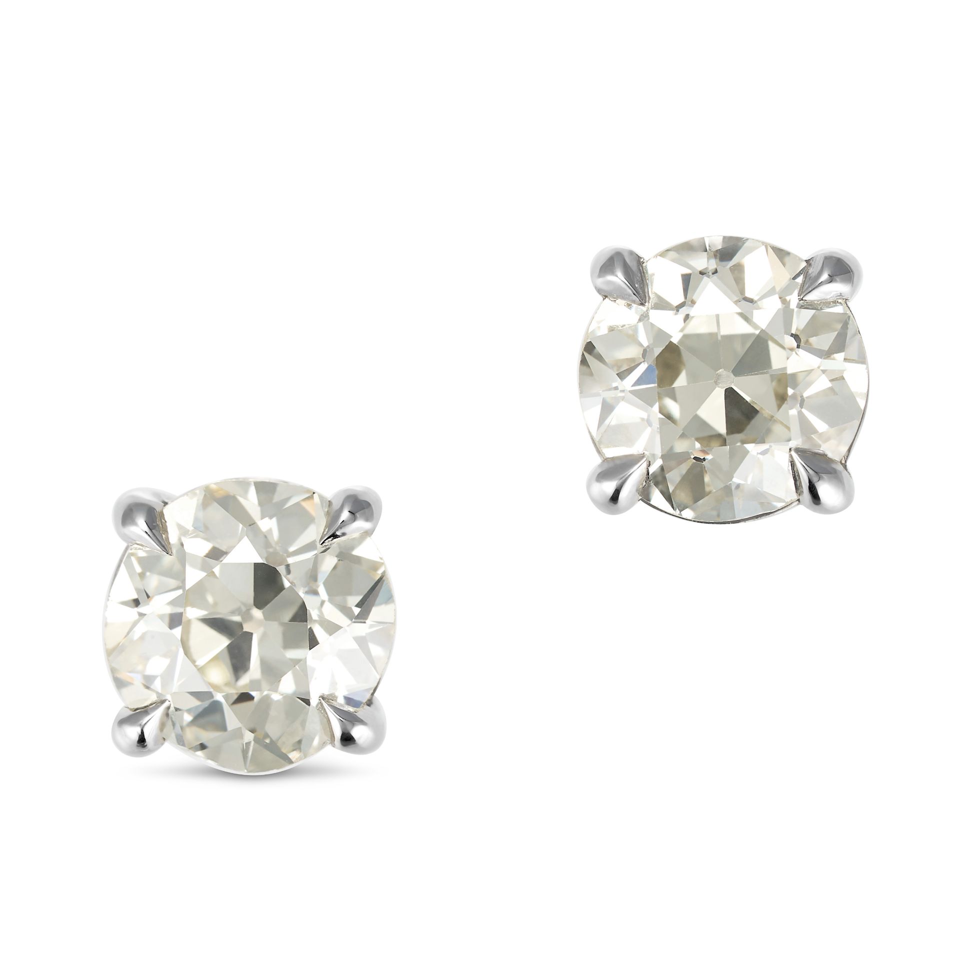 A PAIR OF DIAMOND STUD EARRINGS in 18ct white gold, each set with an old European cut diamond of ...