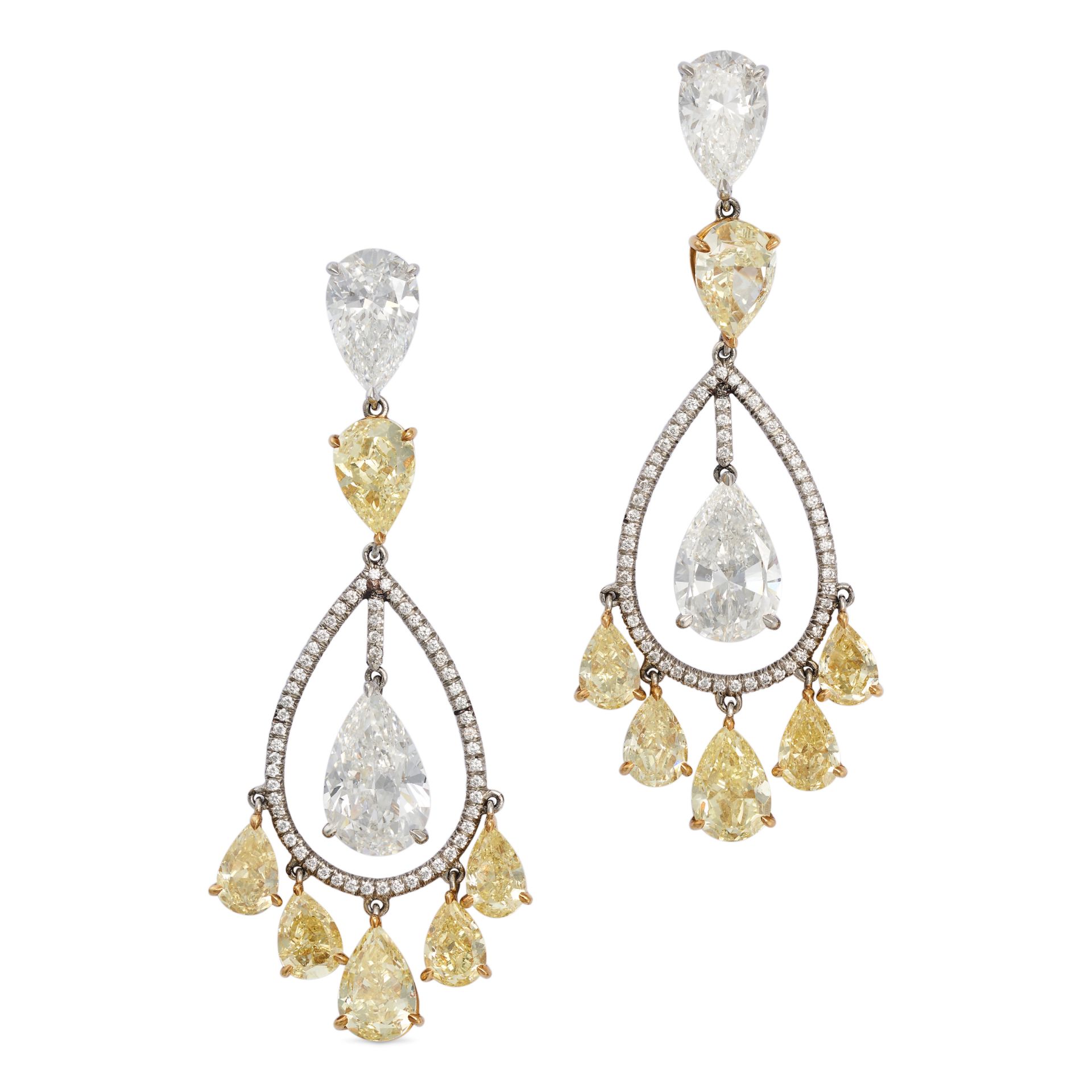 A PAIR OF FANCY YELLOW AND WHITE DIAMOND DROP EARRINGS in platinum, each set with an inverted pea...