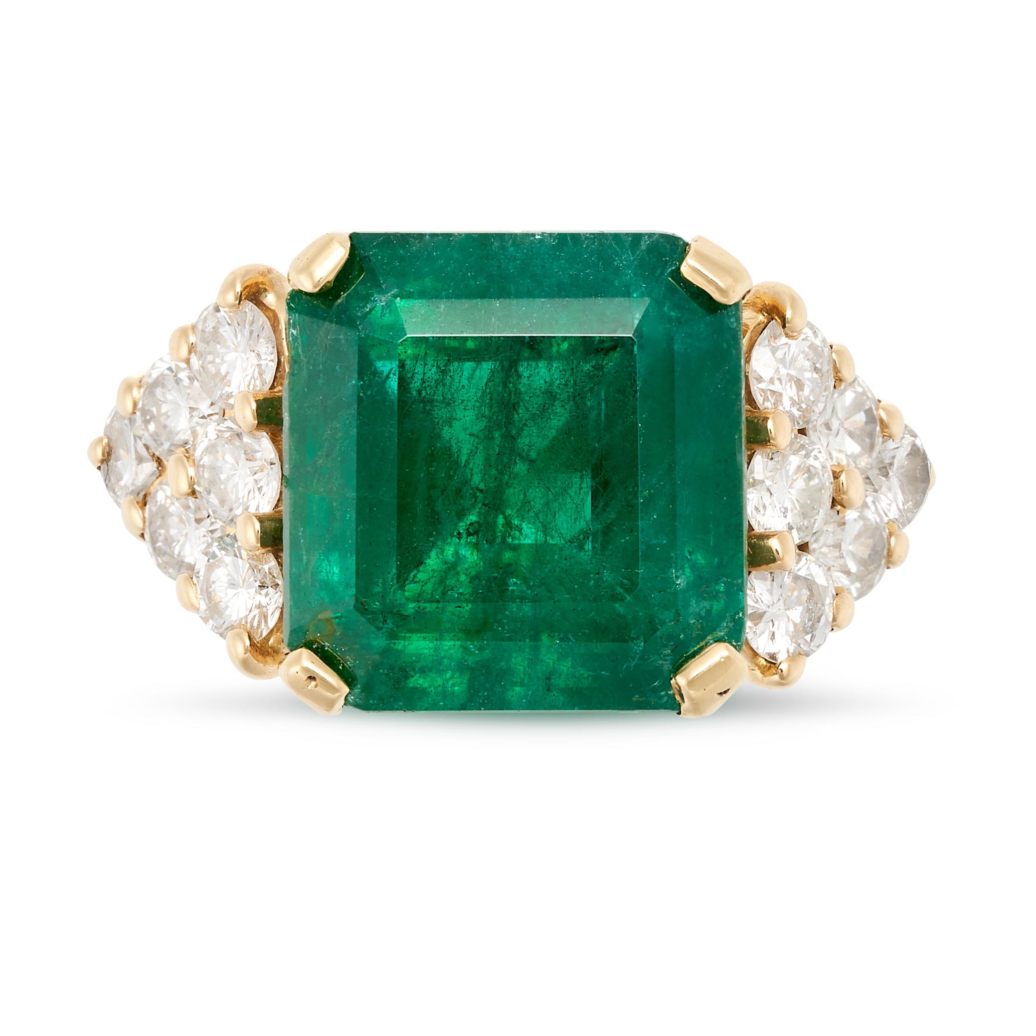 A VINTAGE EMERALD AND DIAMOND RING in yellow gold, set with an octagonal step cut emerald of appr...