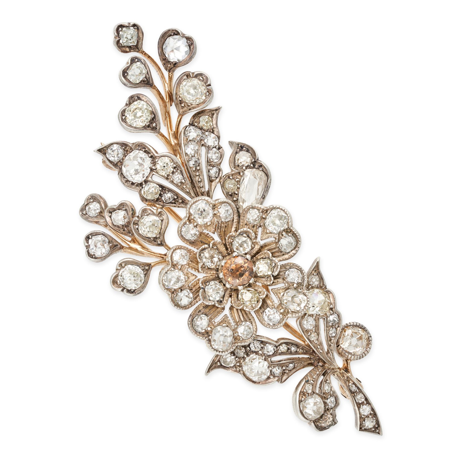 AN ANTIQUE DIAMOND EN TREMBLANT BROOCH in yellow gold and silver, designed as a spray of foliage ...