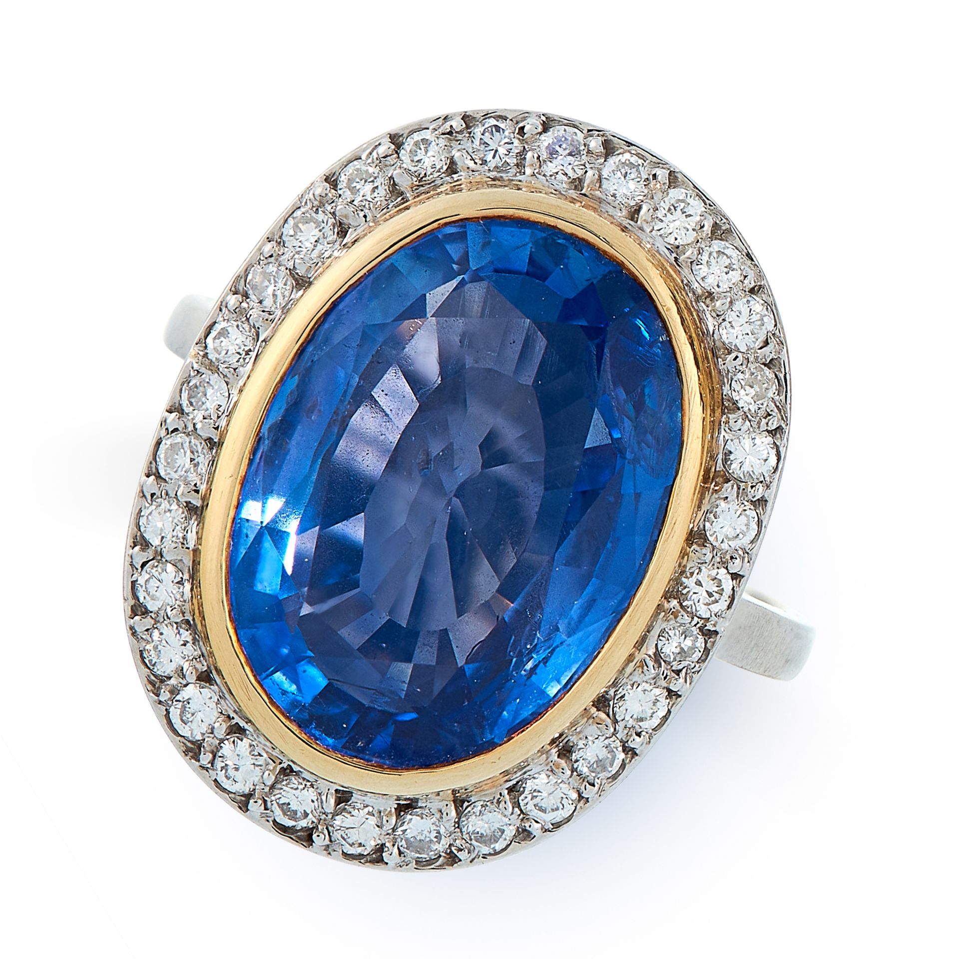 A FRENCH CEYLON NO HEAT SAPPHIRE AND DIAMOND RING in 18ct white and yellow gold, set with an oval...
