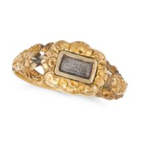 AN ANTIQUE VICTORIAN MOURNING RING in yellow gold, the foliate band set with a central locket pan...