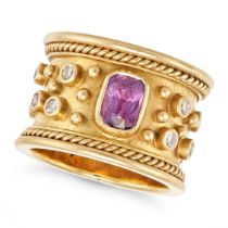 A PINK SAPPHIRE AND DIAMOND DRESS RING in yellow gold, set with a cushion cut pink sapphire, the ...