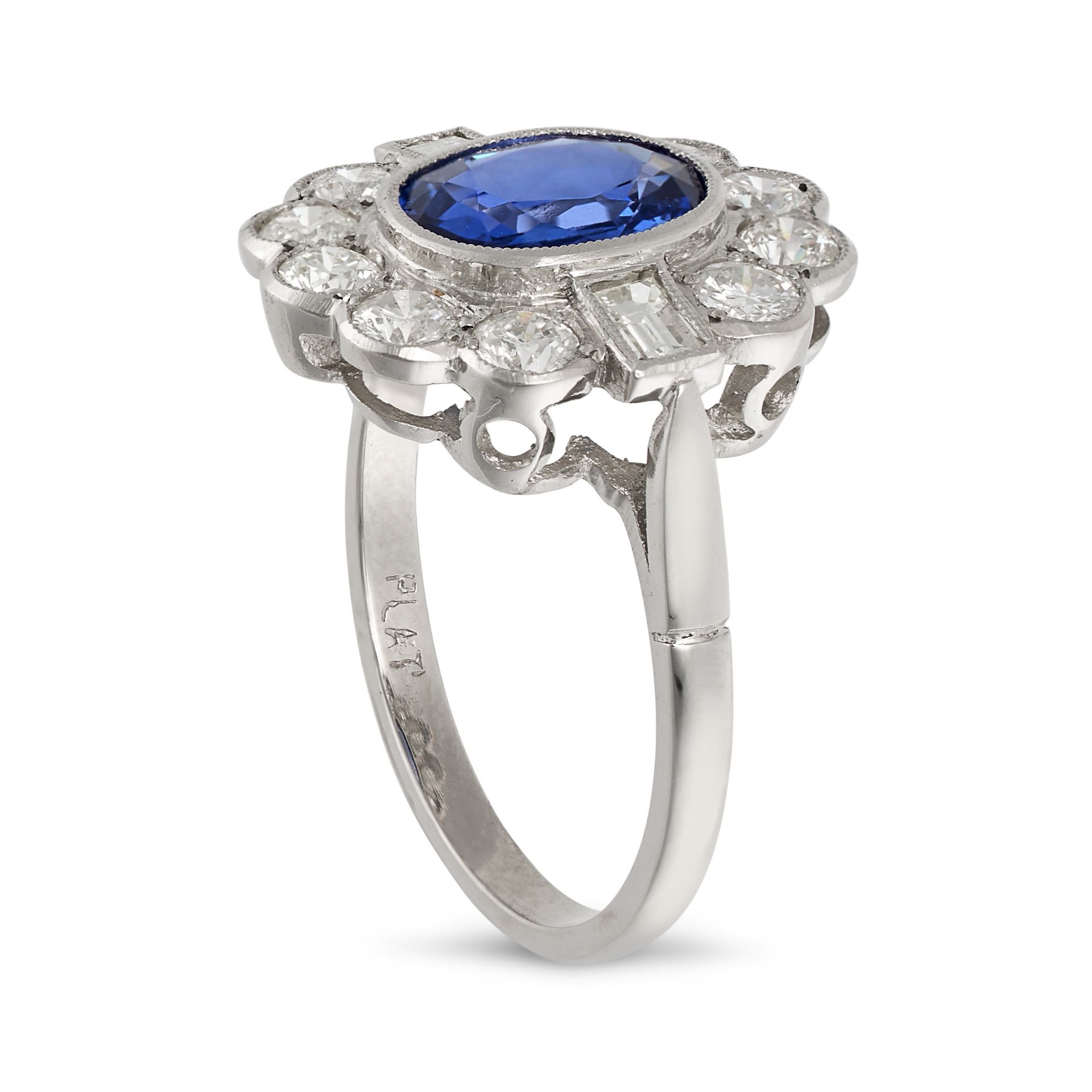 A SAPPHIRE AND DIAMOND CLUSTER RING in platinum, set with an oval cut sapphire of approximately 1... - Image 2 of 2