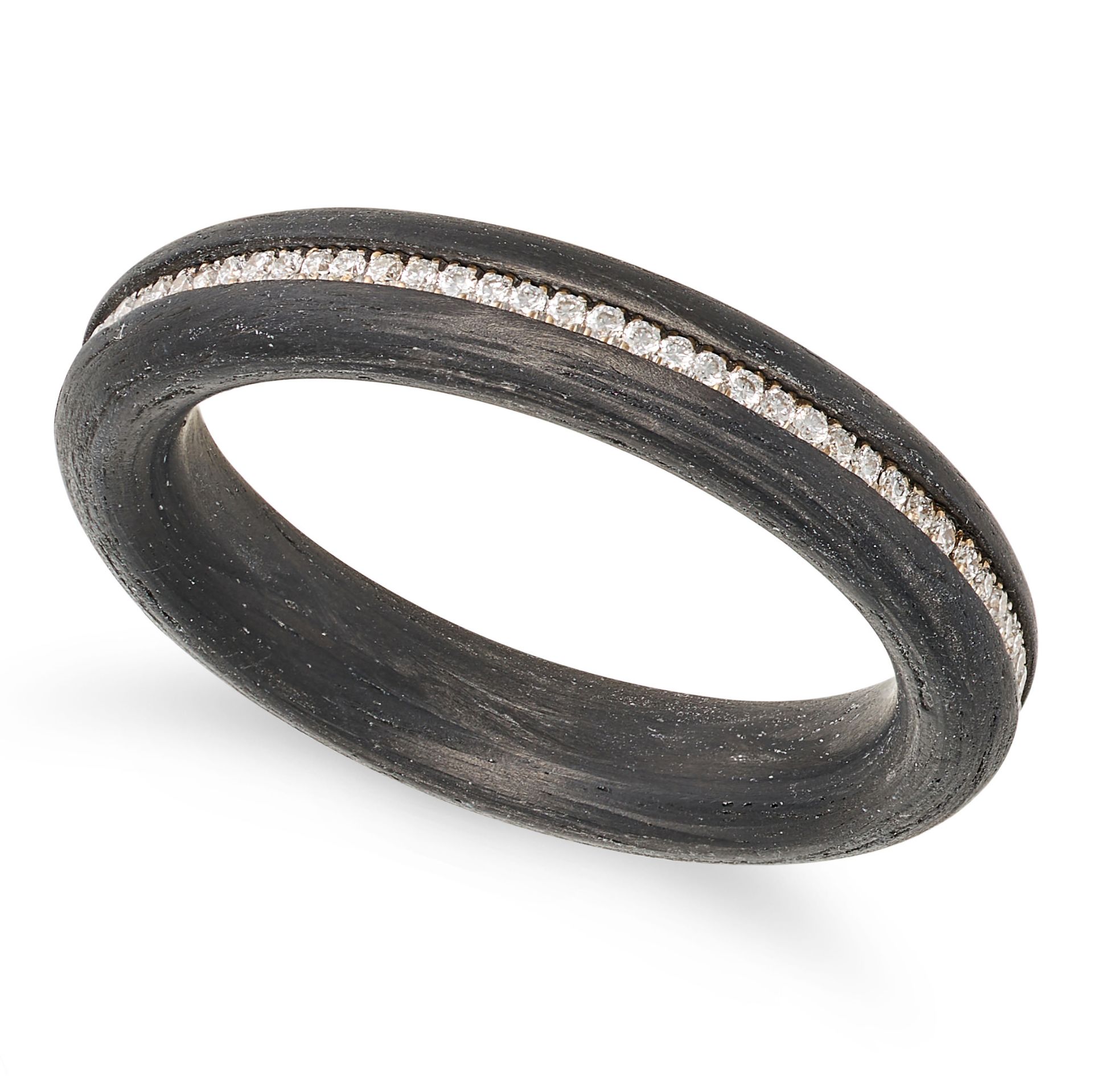 A CARBON AND DIAMOND RING comprising a band of carbon accented by a row of round brilliant cut di...