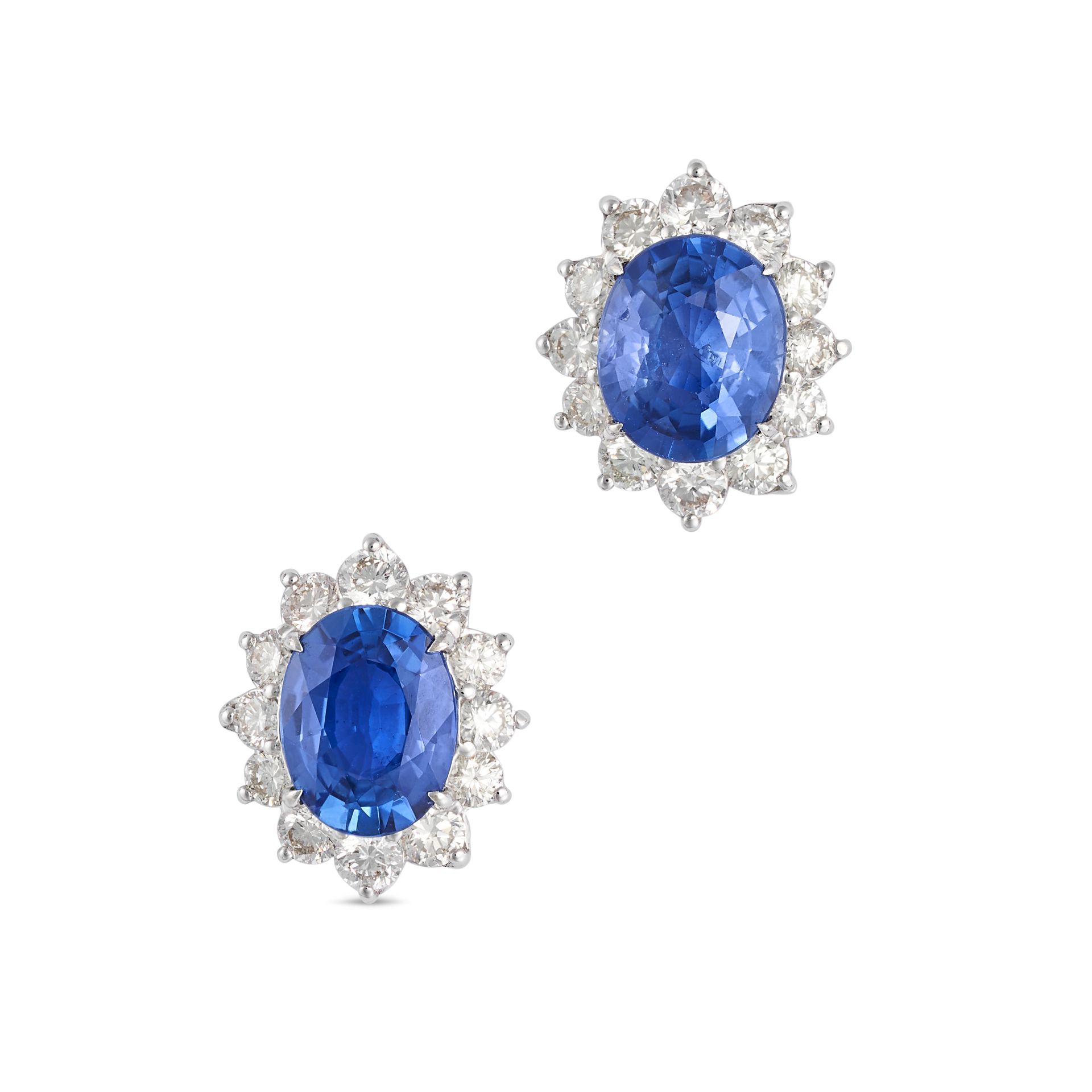 A PAIR OF SAPPHIRE AND DIAMOND CLUSTER EARRINGS in 18ct white gold, each set with an oval cut sap...