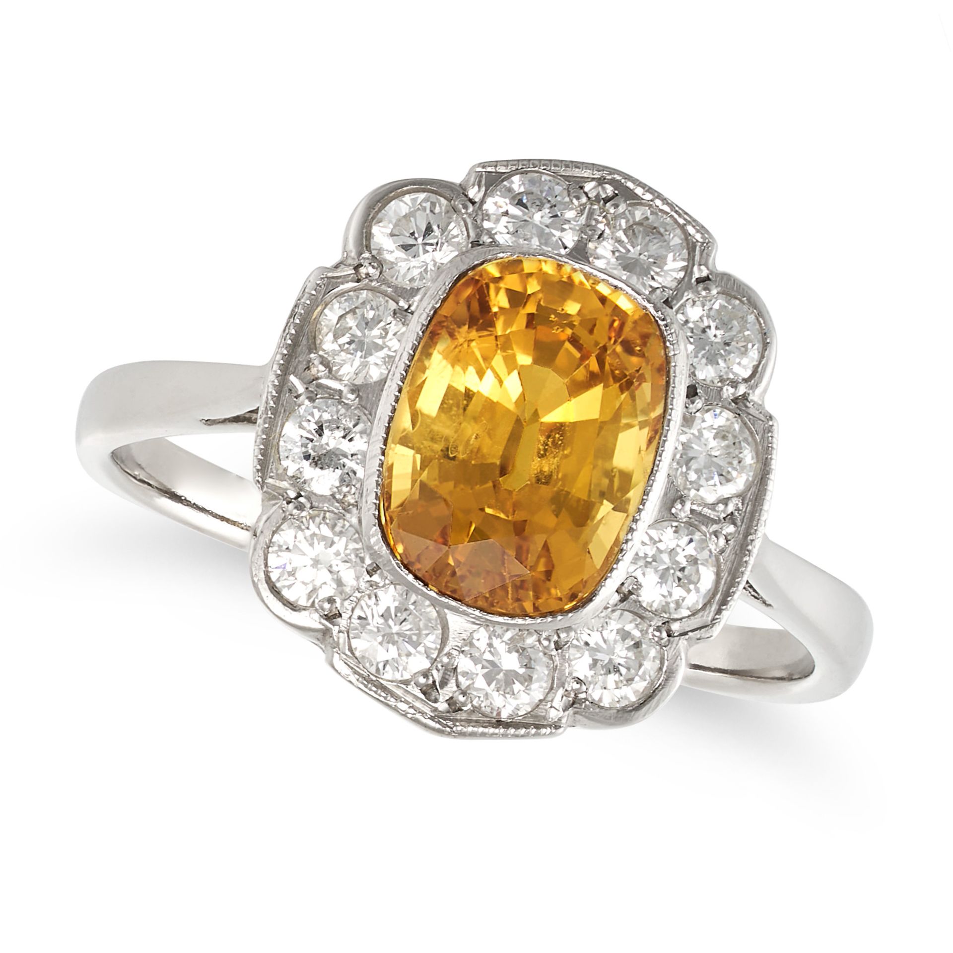A YELLOW SAPPHIRE AND DIAMOND CLUSTER RING in platinum, set with a cushion cut yellow sapphire of...