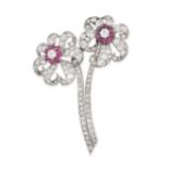 A VINTAGE RUBY AND DIAMOND FLOWER BROOCH in white gold and platinum, designed as a pair of stylis...