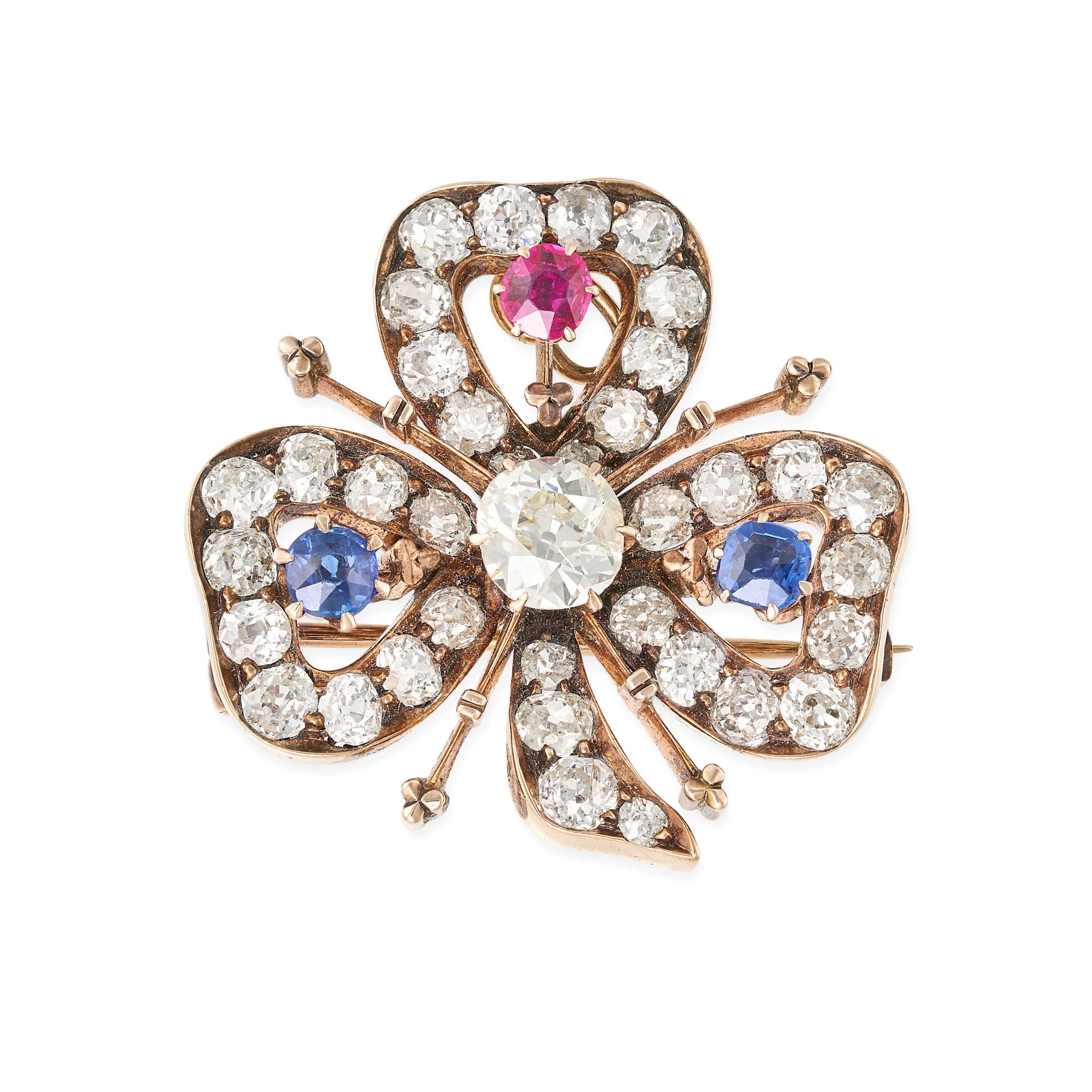 AN ANTIQUE RUBY, SAPPHIRE AND DIAMOND CLOVER BROOCH / PENDANT in 14ct rose gold, designed as a th...