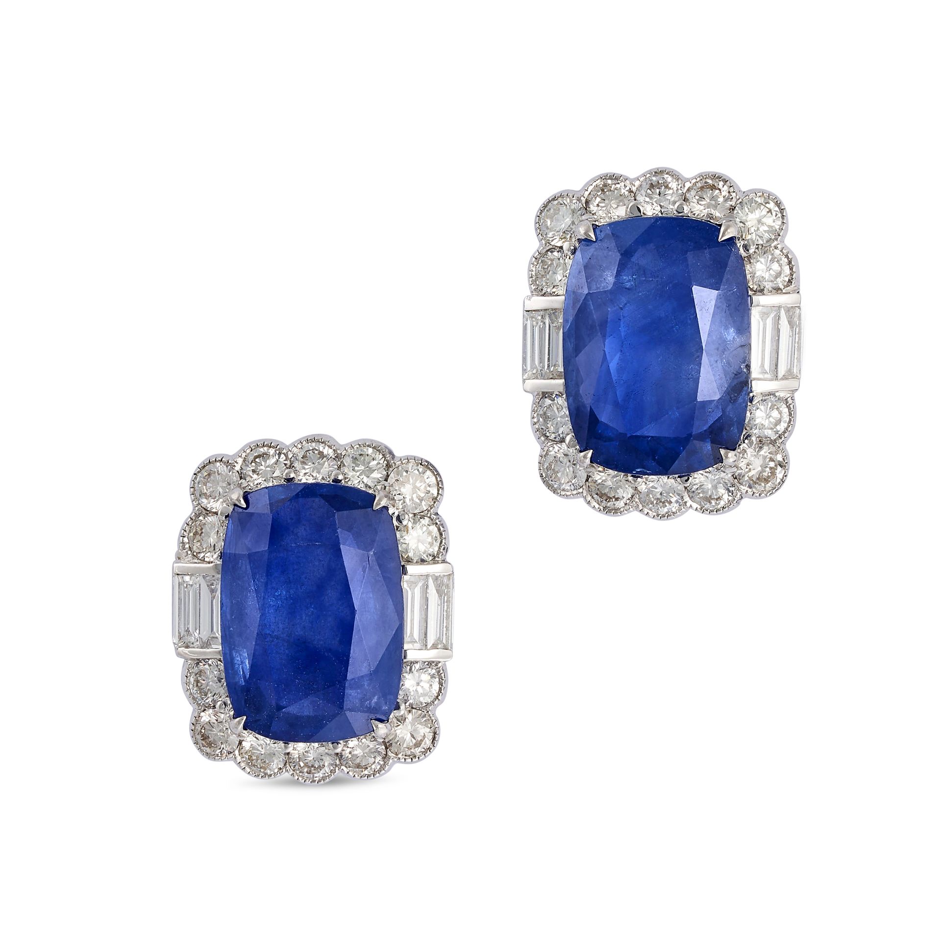 A PAIR OF SAPPHIRE AND DIAMOND CLUSTER EARRINGS in 18ct white gold, each set with a cushion cut s...