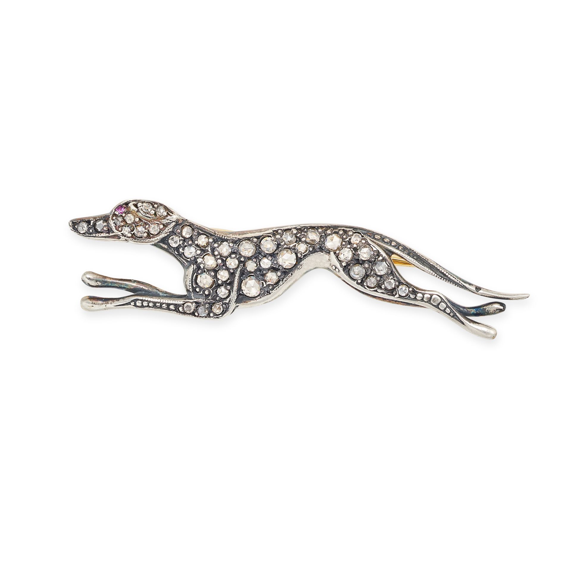 AN ANTIQUE DIAMOND AND RUBY DOG BROOCH in yellow gold and silver, designed as a greyhound set thr...