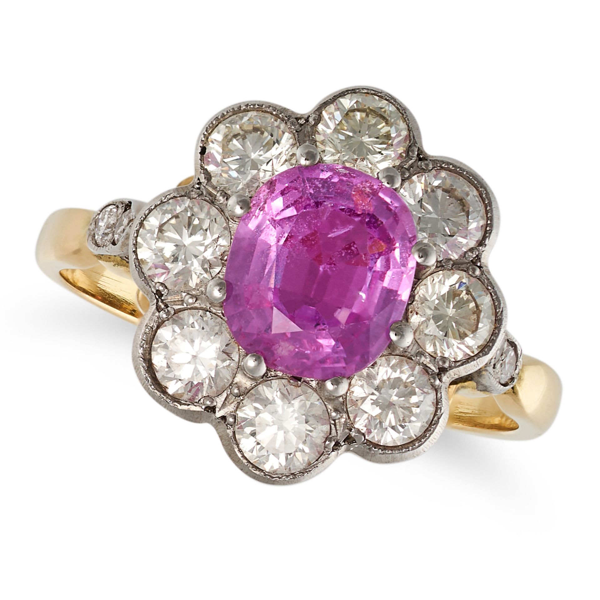 A PINK SAPPHIRE AND DIAMOND CLUSTER RING in yellow gold, set with a cushion cut pink sapphire of ...
