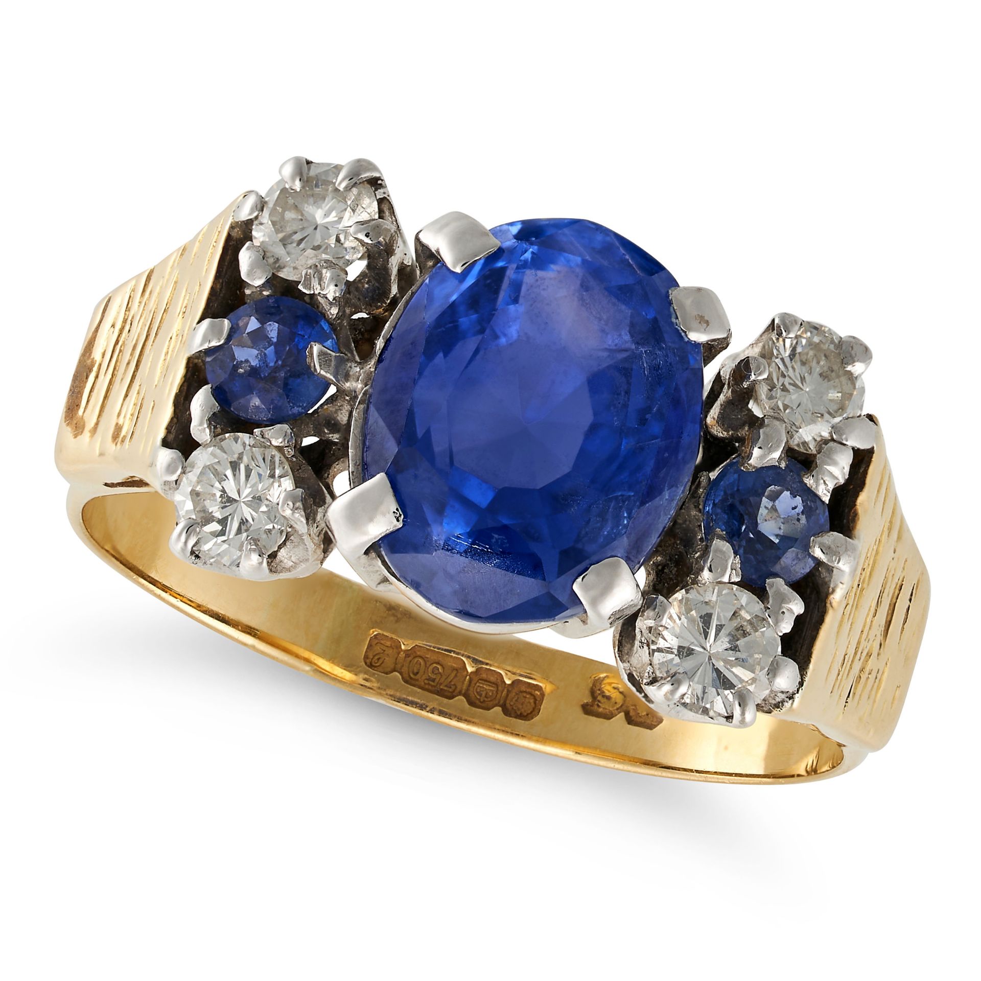 A VINTAGE CEYLON NO HEAT SAPPHIRE AND DIAMOND RING in 18ct yellow gold, set with an oval cut sapp...