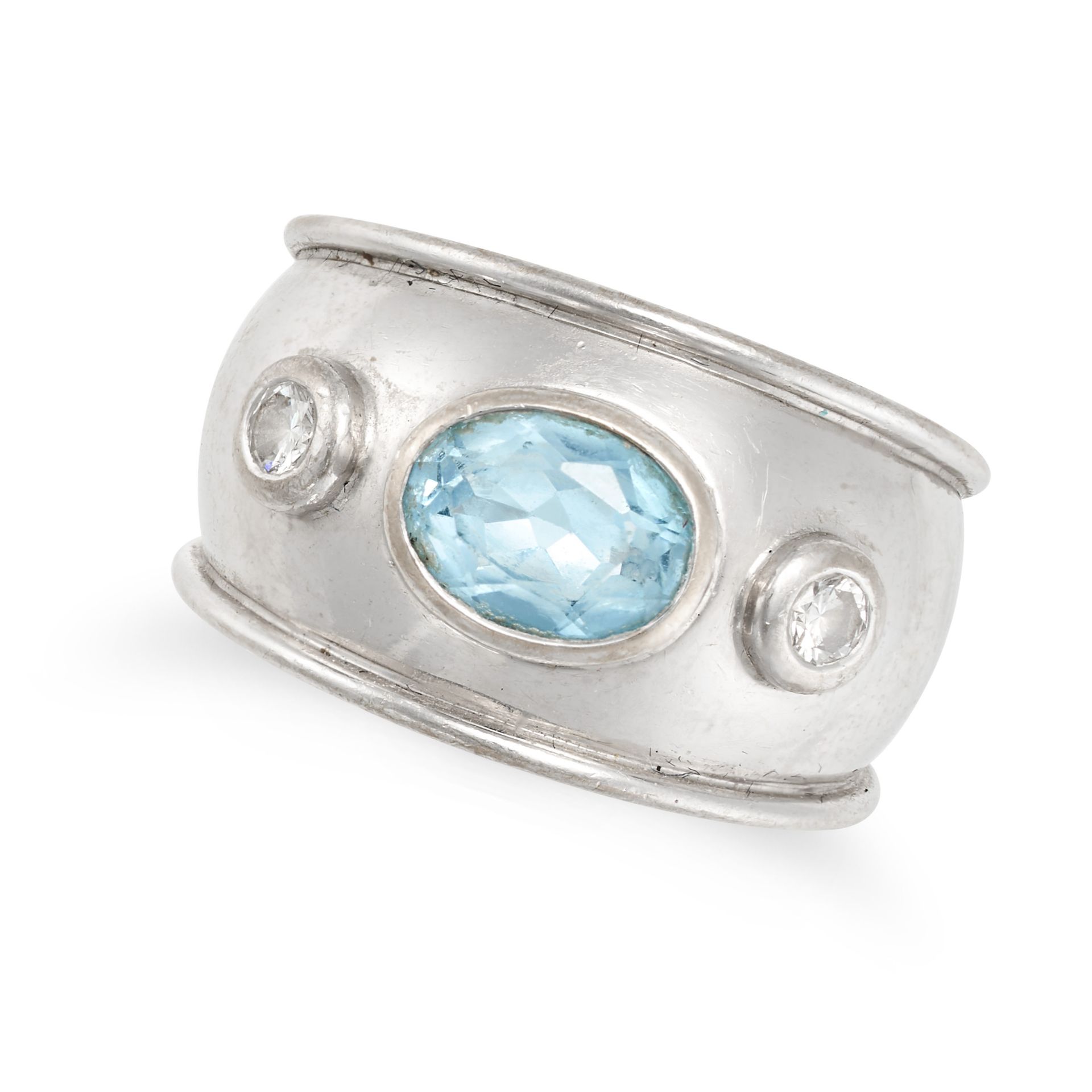 THEO FENNELL, A BLUE TOPAZ AND DIAMOND RING in 18ct white gold, the wide tapering band set with a...
