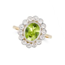 A PERIDOT AND DIAMOND CLUSTER RING in 18ct yellow gold, set with an oval cut peridot of approxima...