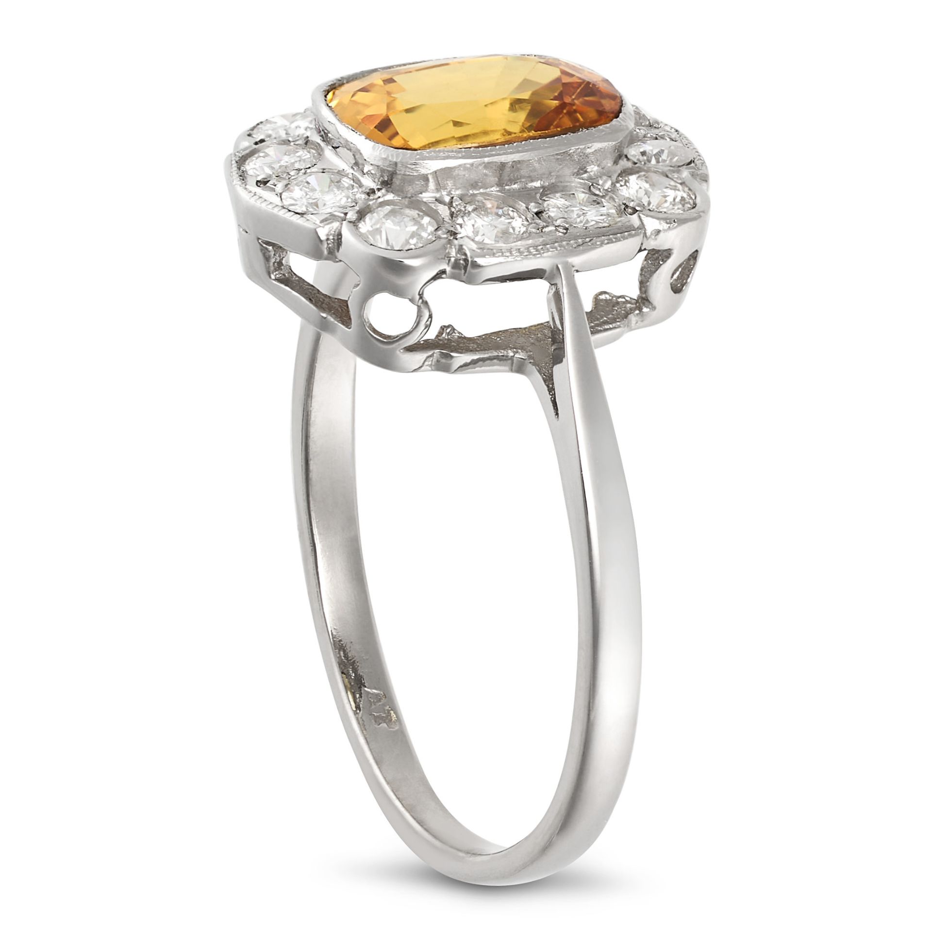 A YELLOW SAPPHIRE AND DIAMOND CLUSTER RING in platinum, set with a cushion cut yellow sapphire of... - Image 2 of 2