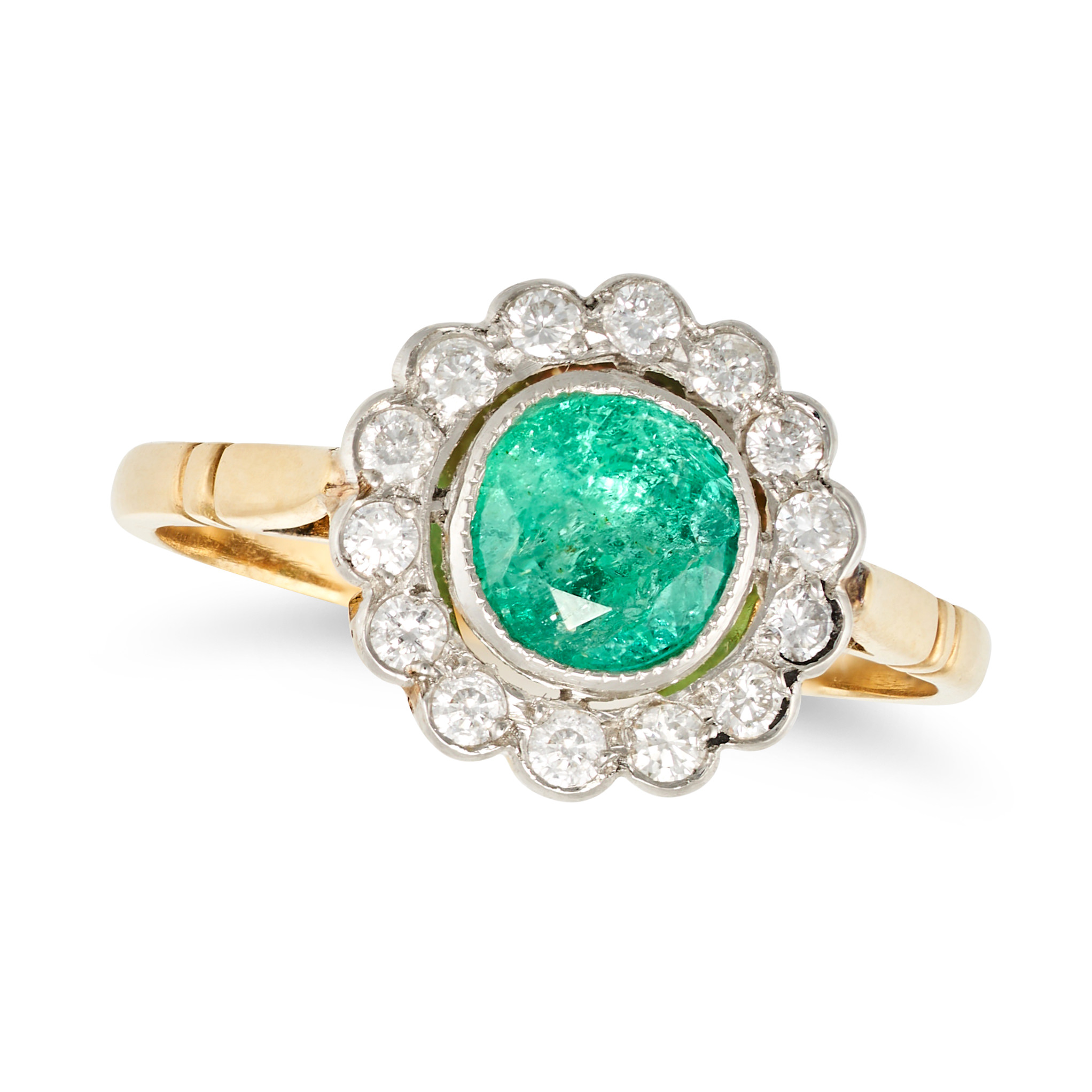 NO RESERVE - AN EMERALD AND DIAMOND CLUSTER RING in yellow and white gold, set with a round cut e...