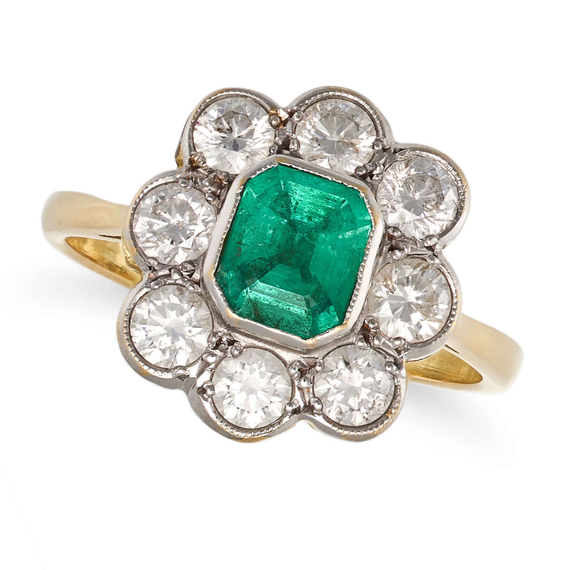 AN EMERALD AND DIAMOND CLUSTER RING in yellow gold, set with an octagonal step cut emerald of app...