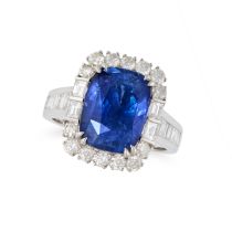 A SAPPHIRE AND DIAMOND CLUSTER RING in 18ct white gold, set with a cushion cut sapphire of 6.91 c...